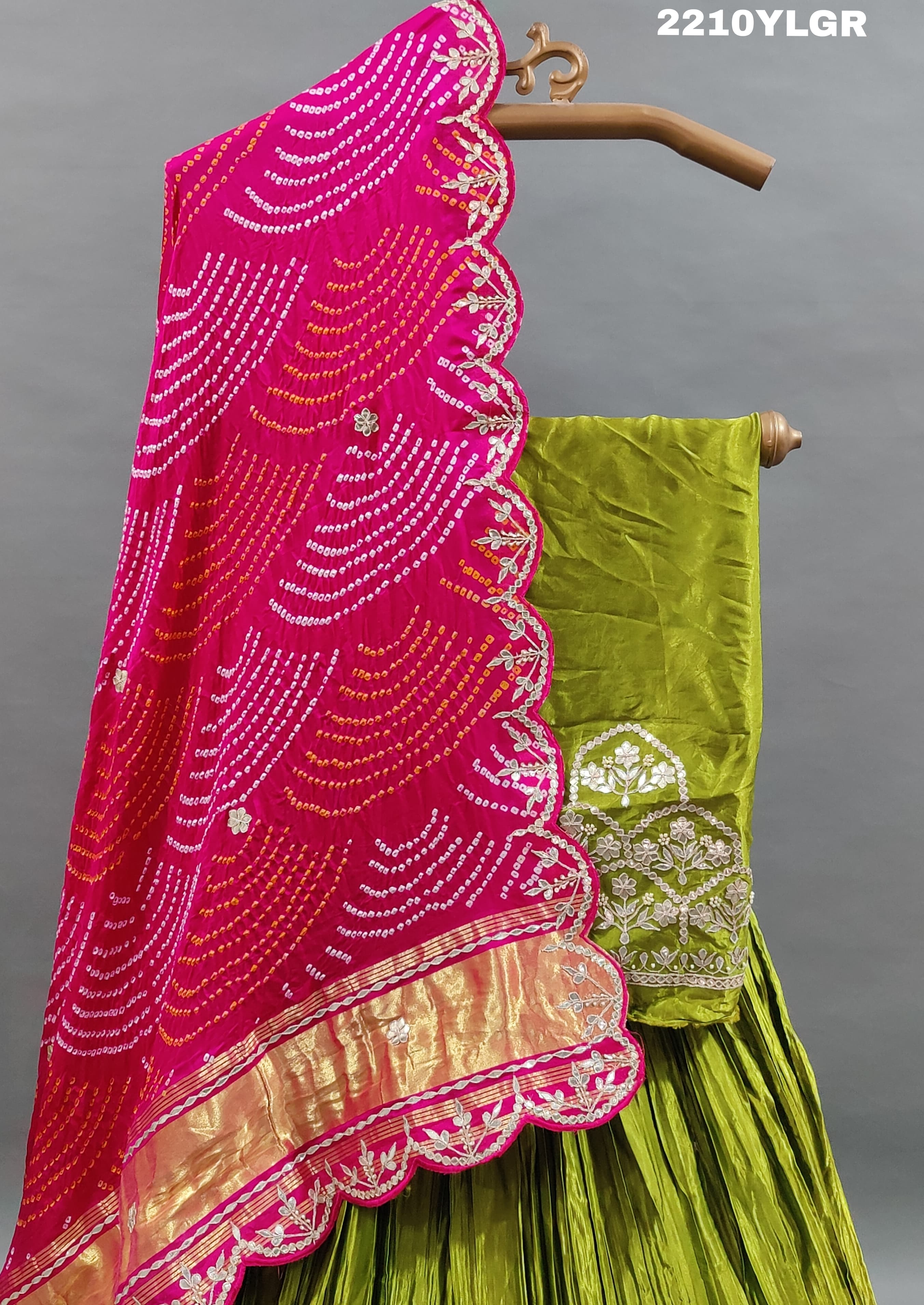 A traditional style lehenga with Bandhani style print and Gota Patti work, featuring green color