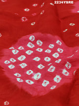 A red and white bandhani style saree
