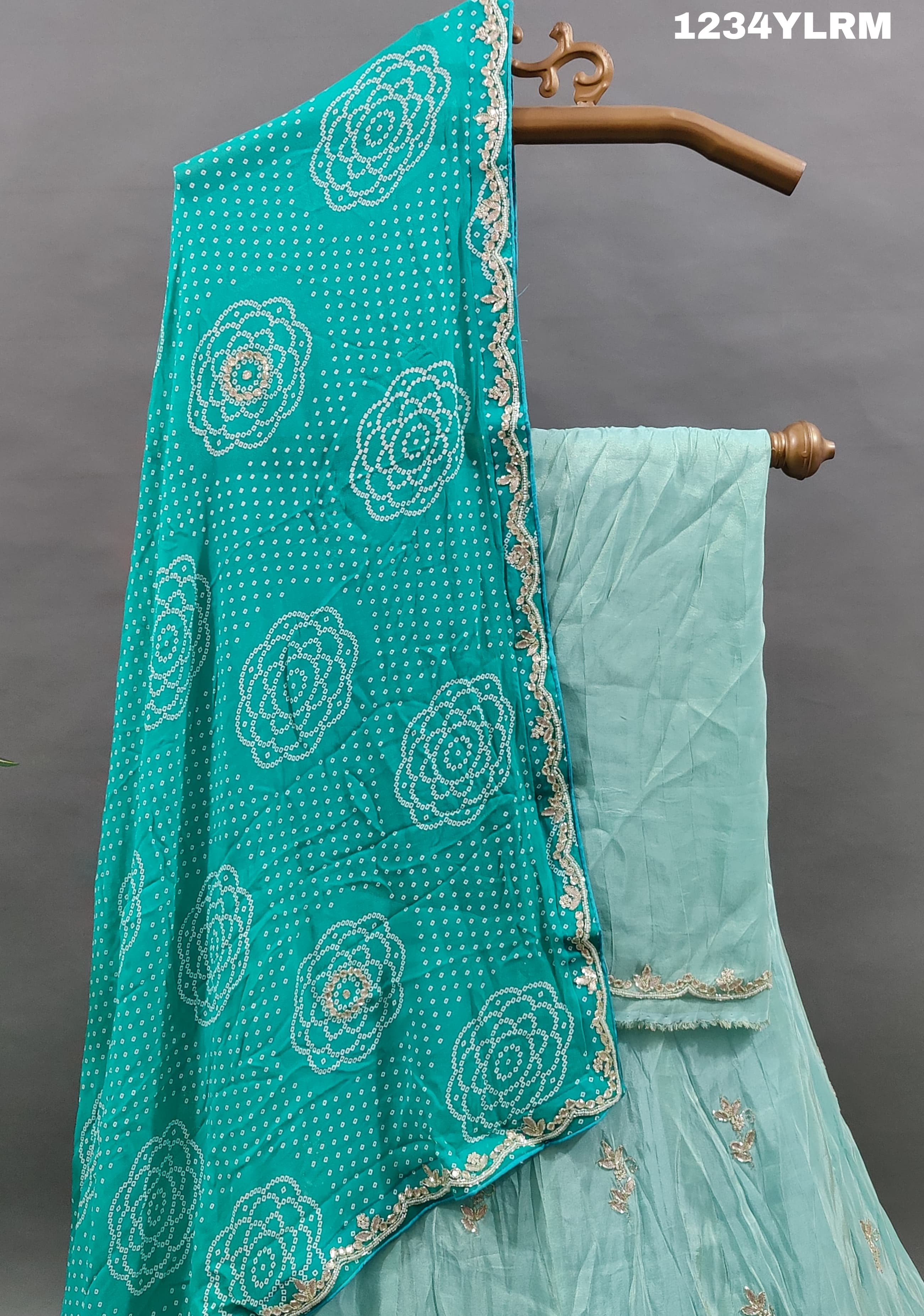 A traditional Indian lehenga with cutdana and gotapatti work