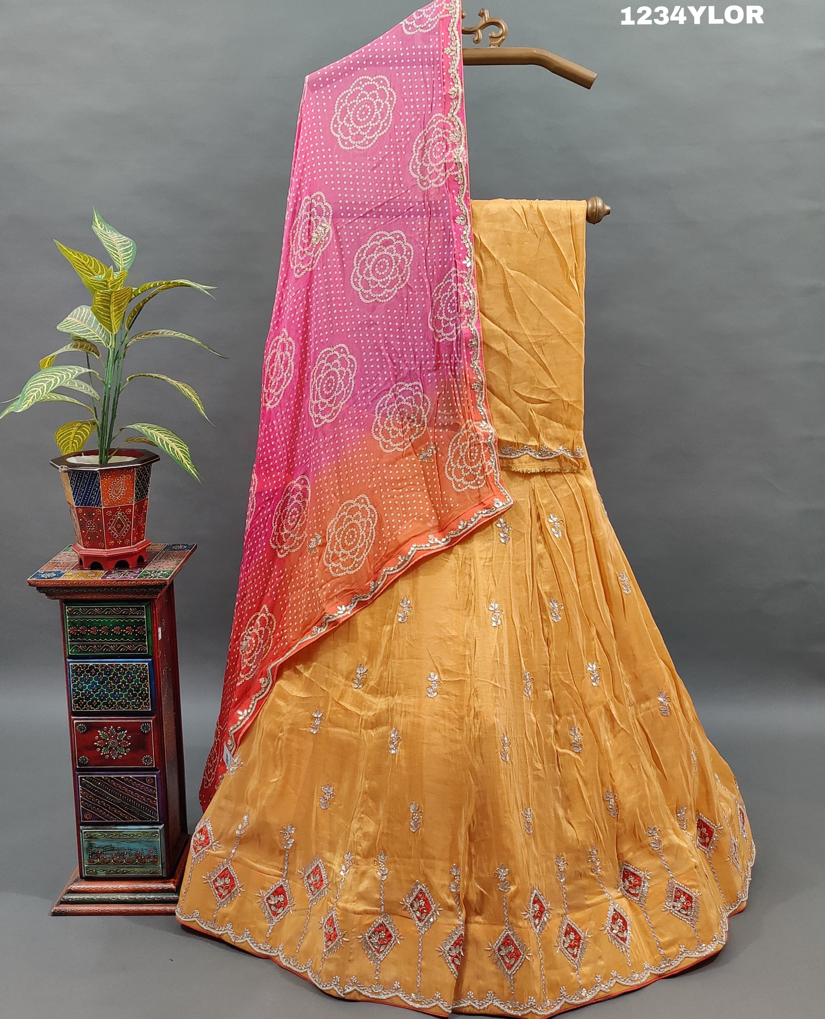 Traditional Indian lehenga choli with cutdana and gotapatti work