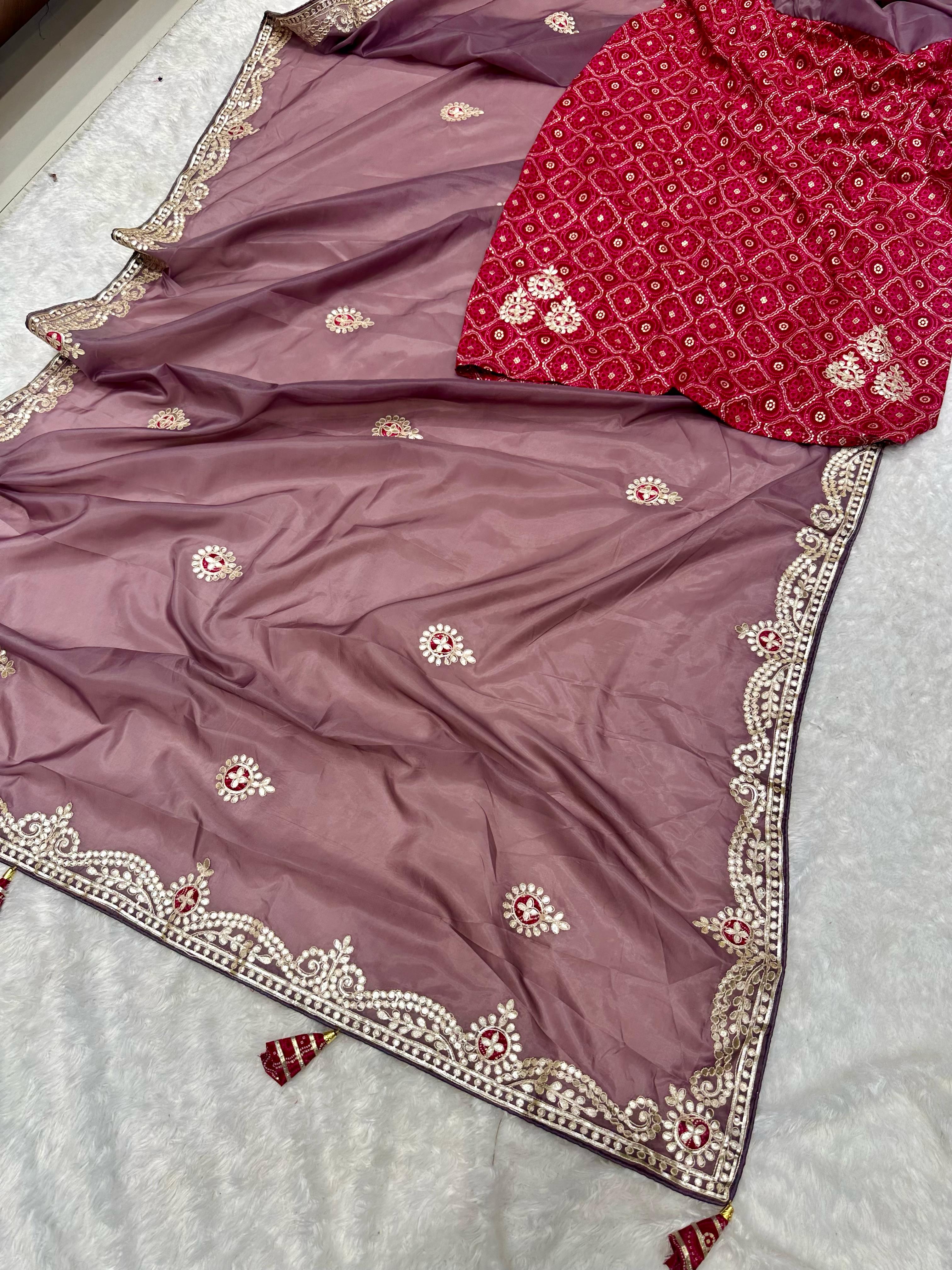 A purple saree with detailed Bollywood-style embroidery and gotapatti work
