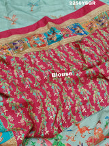 A cotton silk saree with a kalamkari style foil print design featuring multiple colors including red, green, and beige.