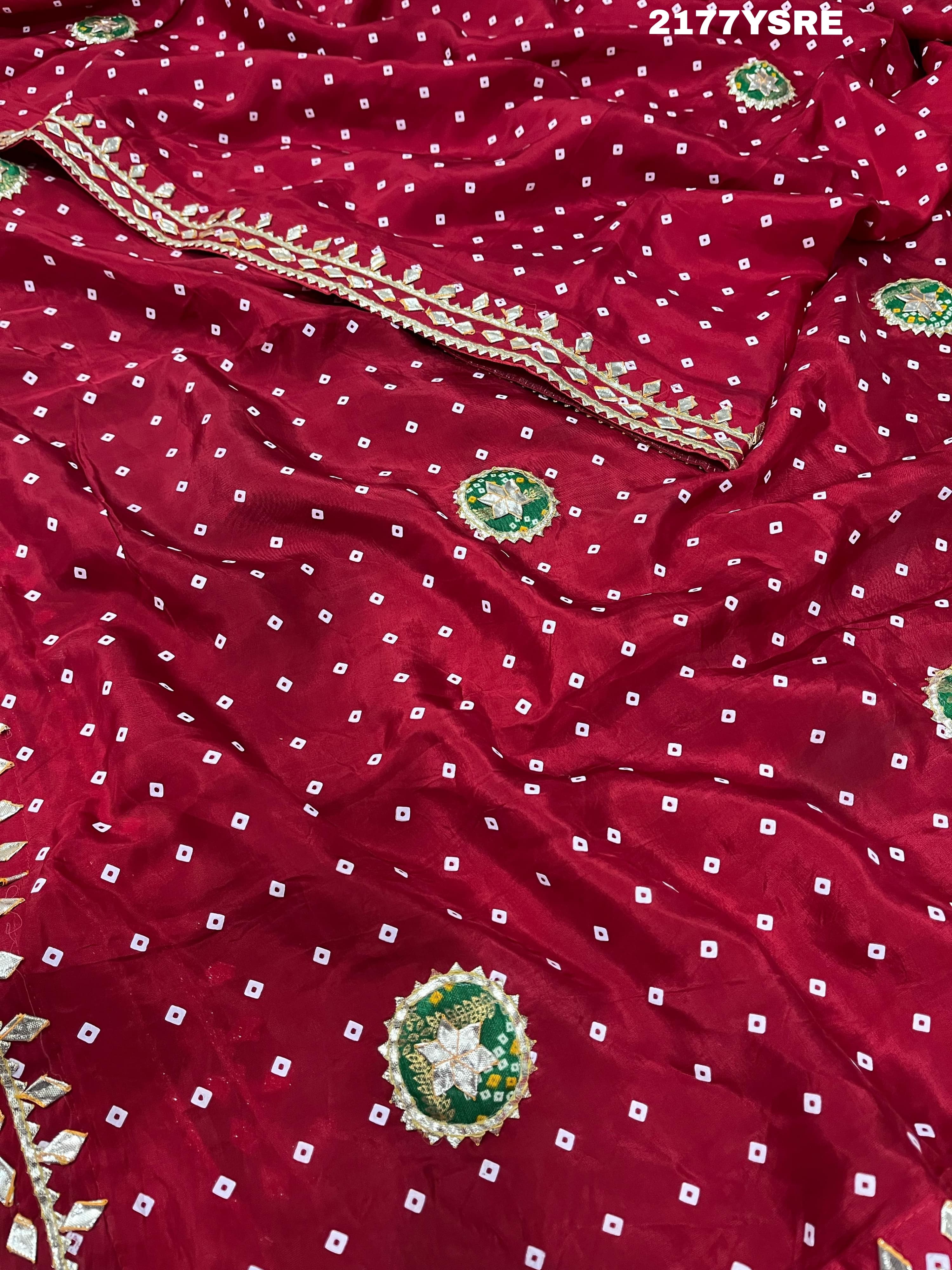 A red and blue modal silk bandhani saree with kachha gotapatti work, including intricate patterns and designs.
