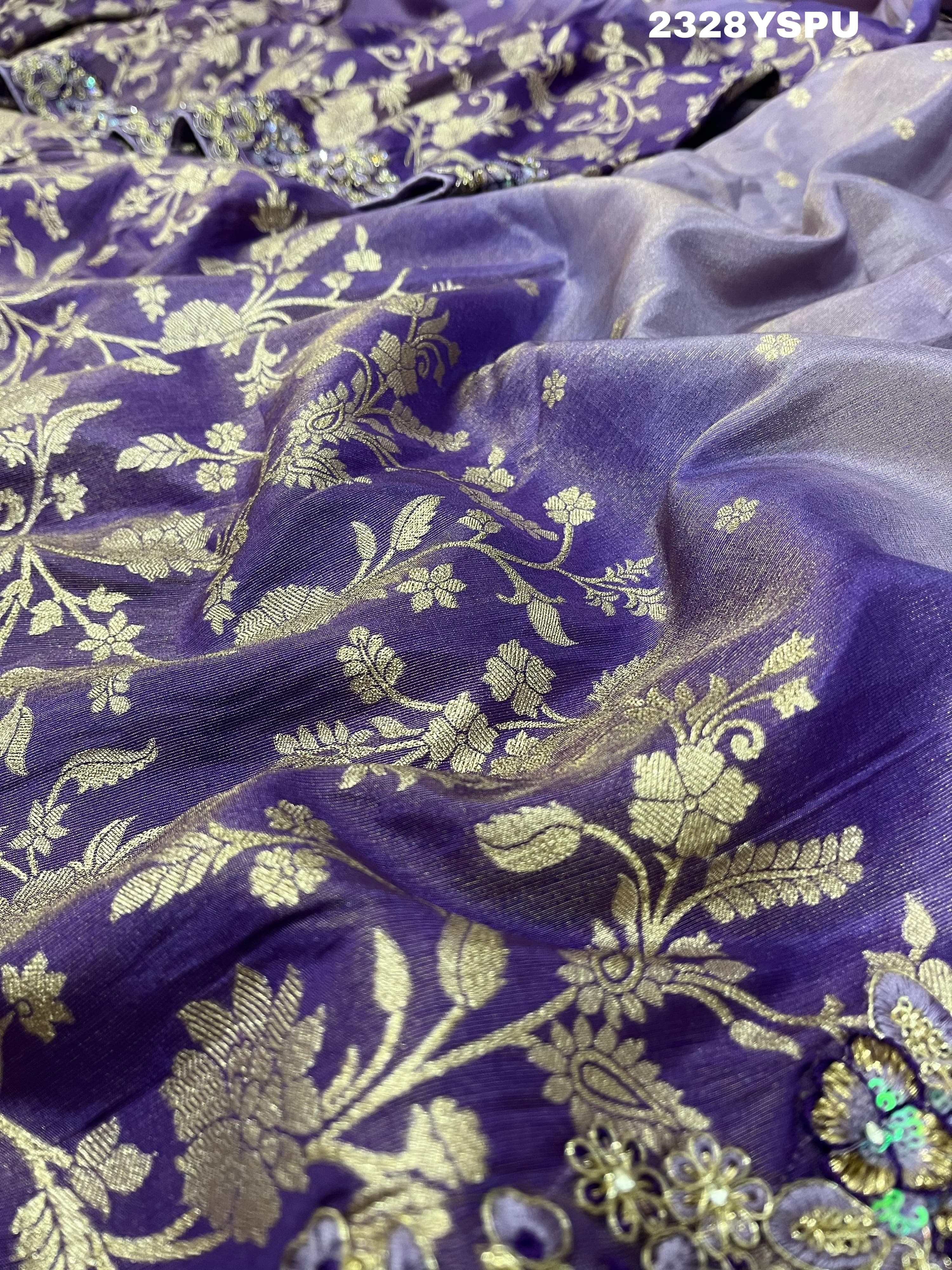 A purple Banarasi style saree with sequence embroidery work