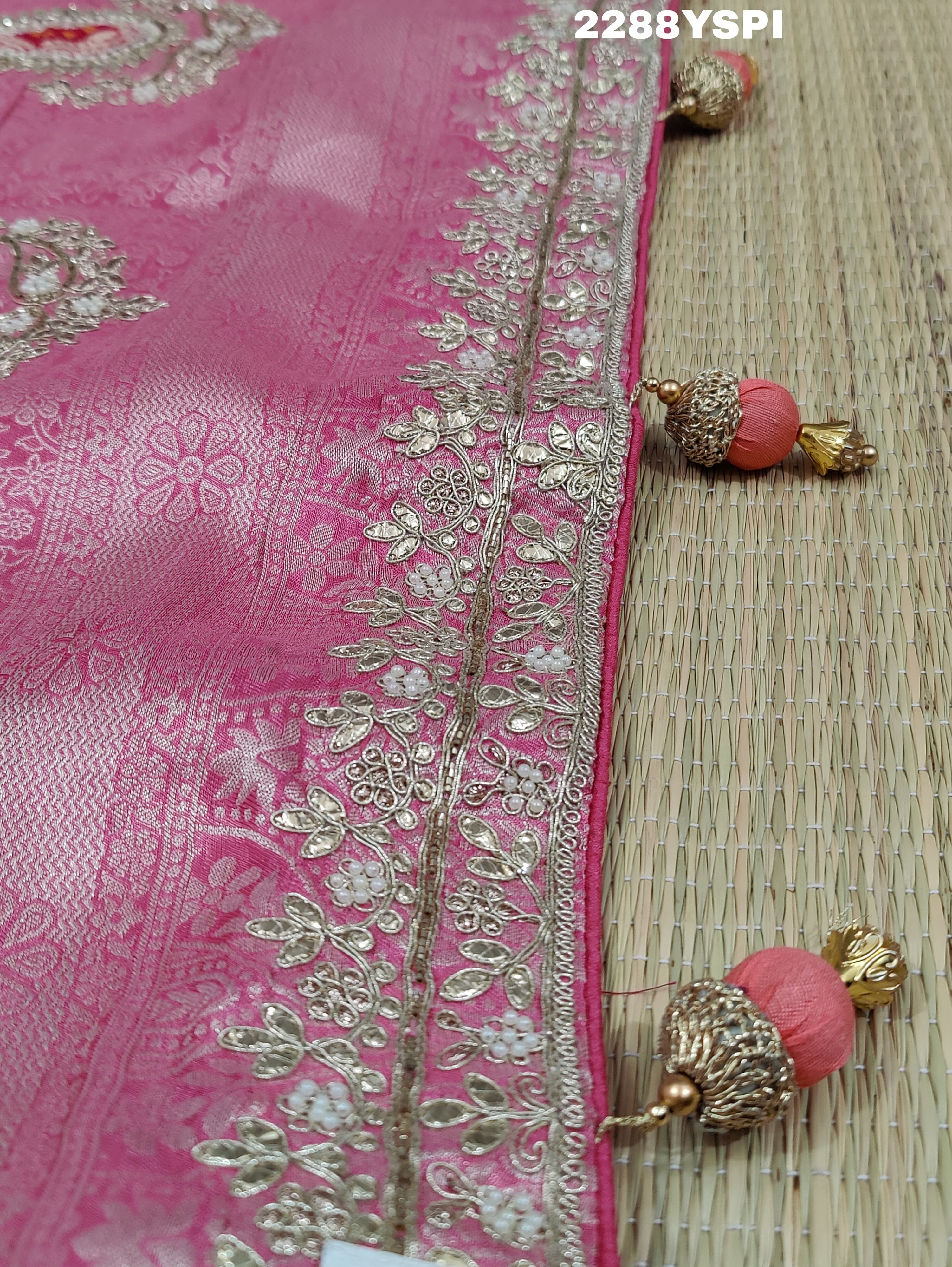 A pink Banarsi silk Bollywood style saree with sequence and gotapatti work