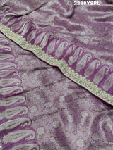 A purple Banarsi silk Bollywood style saree with sequence and gotapatti work, showing detailed patterns and embroidery.