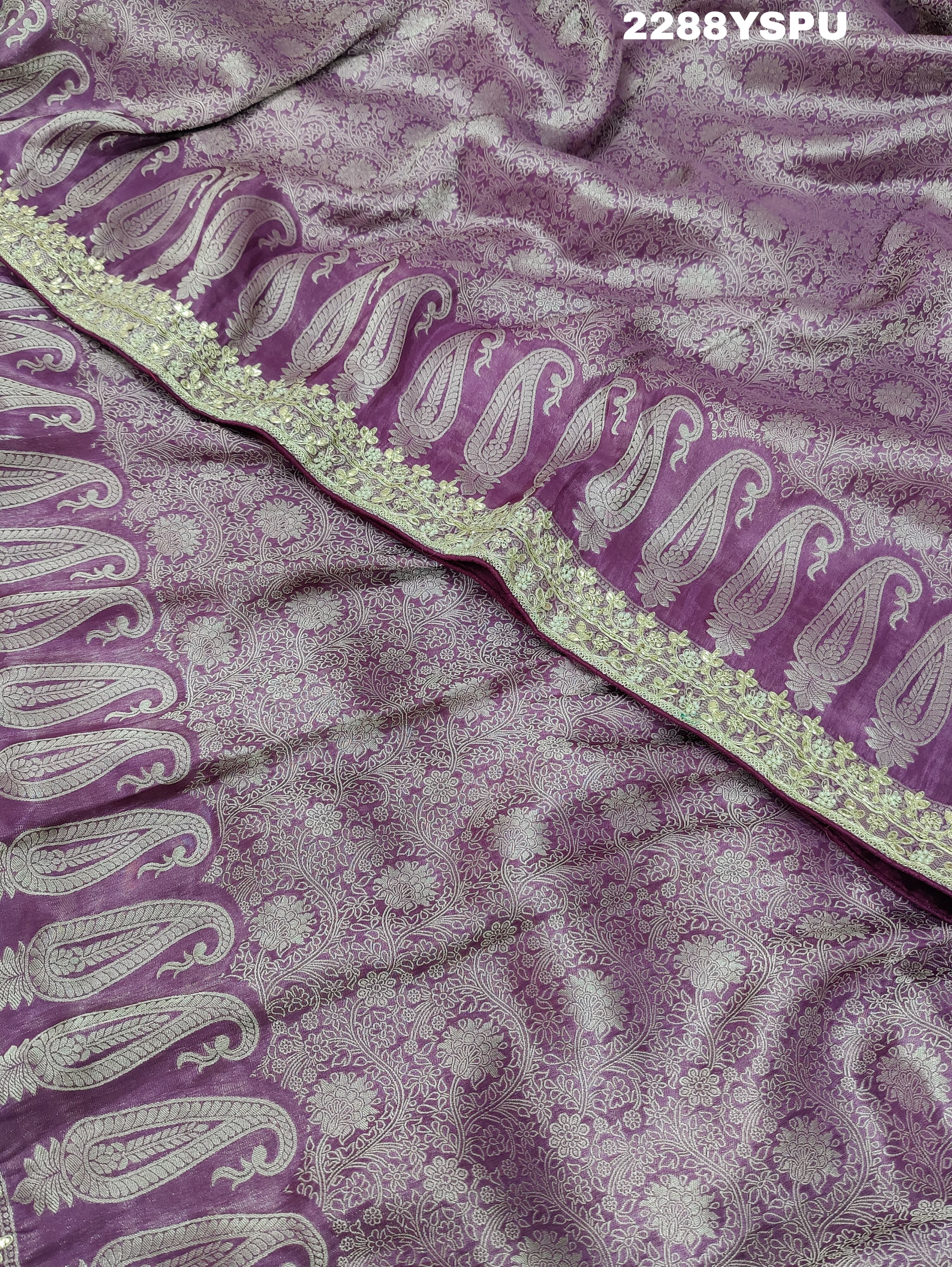 A purple Banarsi silk Bollywood style saree with sequence and gotapatti work, showing detailed patterns and embroidery.