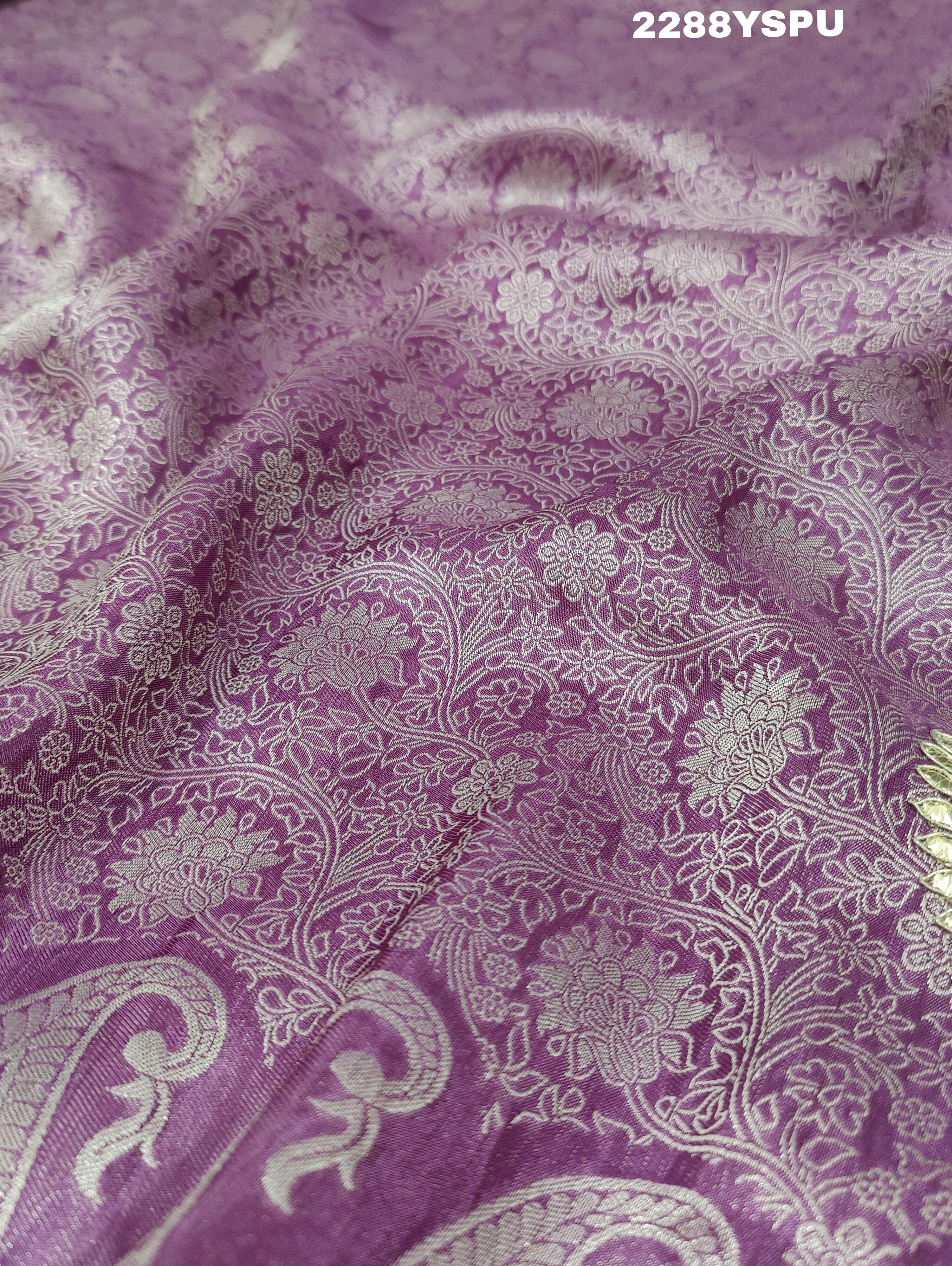 A purple Banarsi silk Bollywood style saree with sequence and gotapatti work, showing detailed patterns and embroidery.