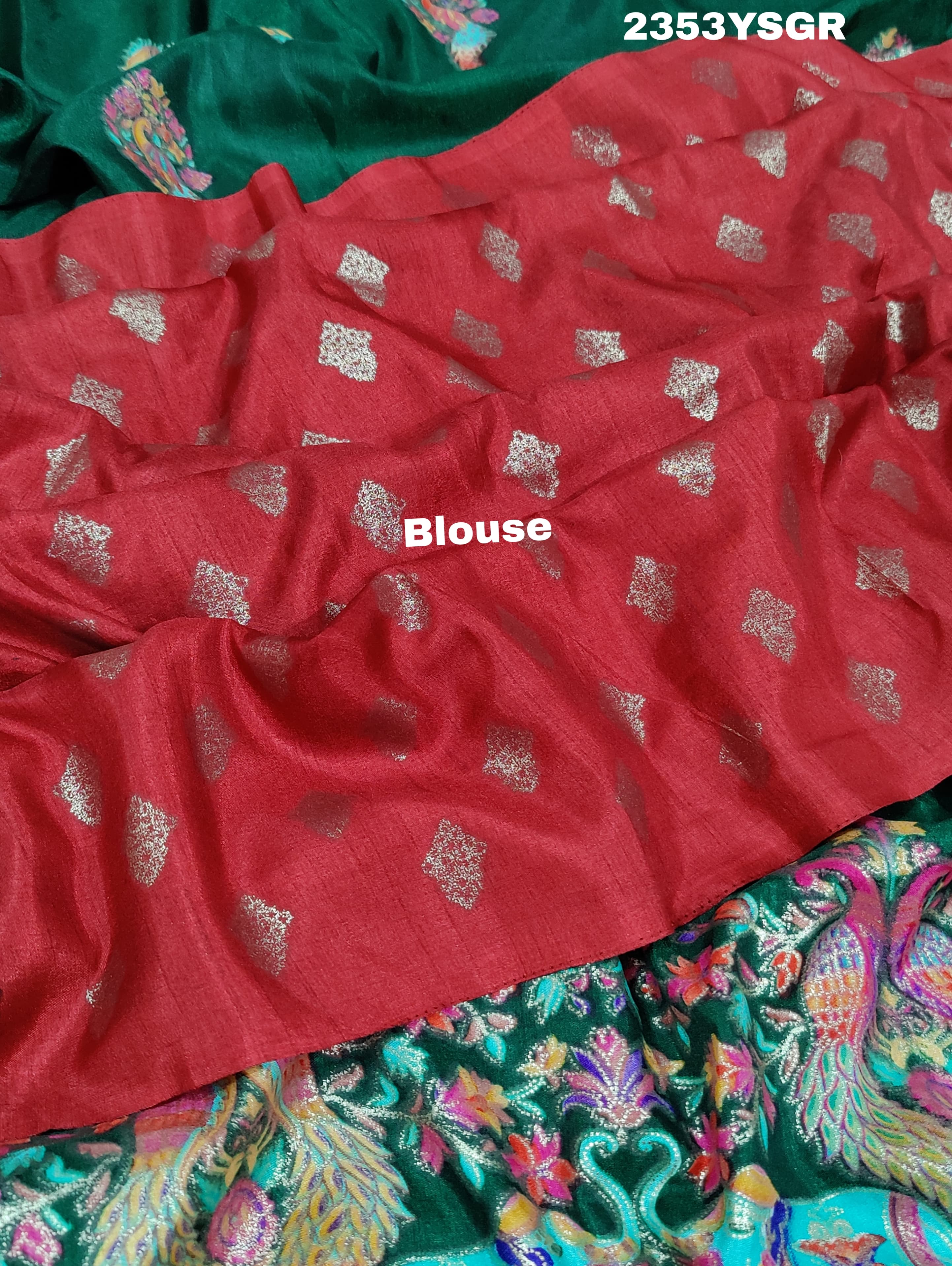 A green saree with a colorful borderin Dola Silk KalamkariStyle