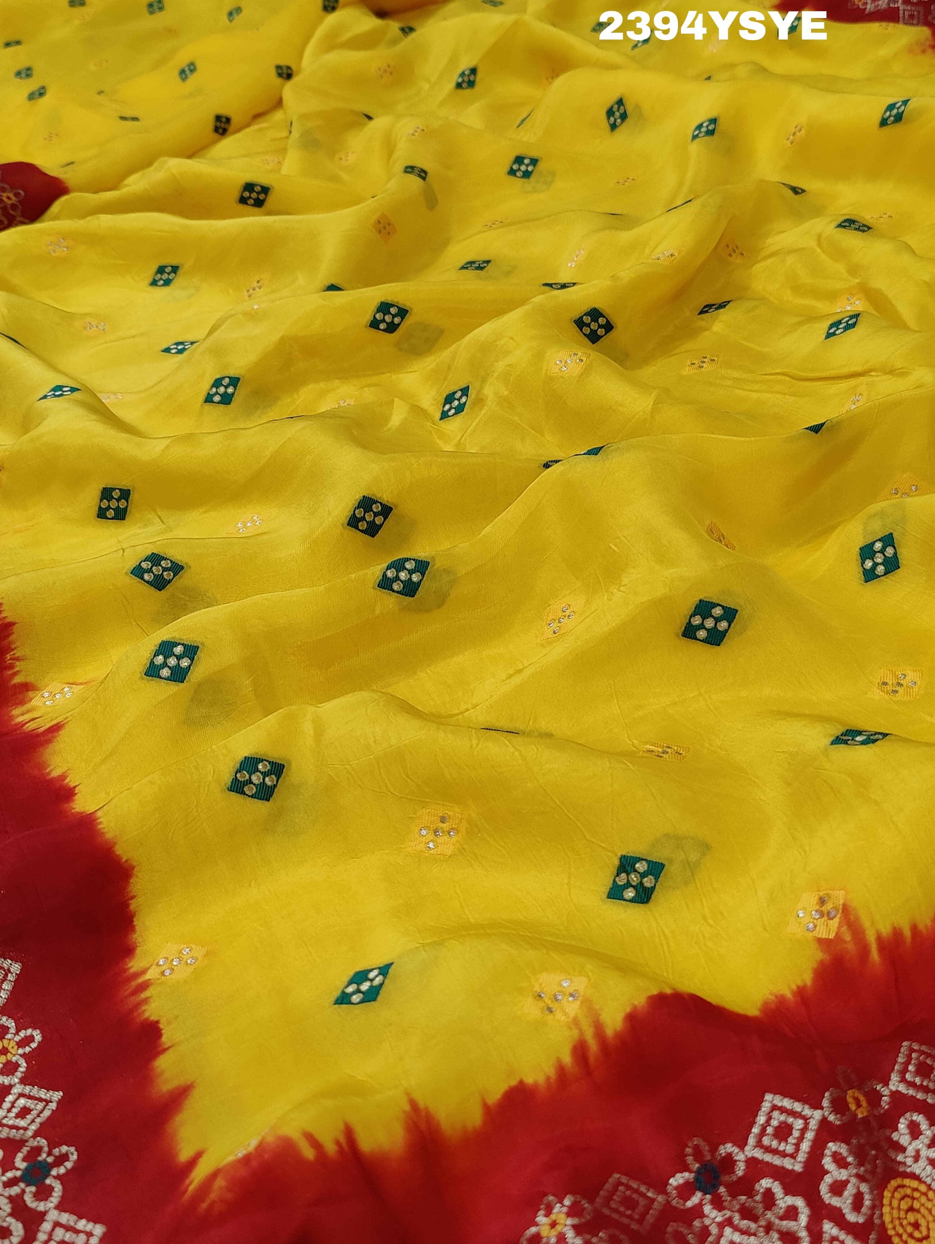 A yellow and red Dola silk saree with Zari weaving and a floral pattern,