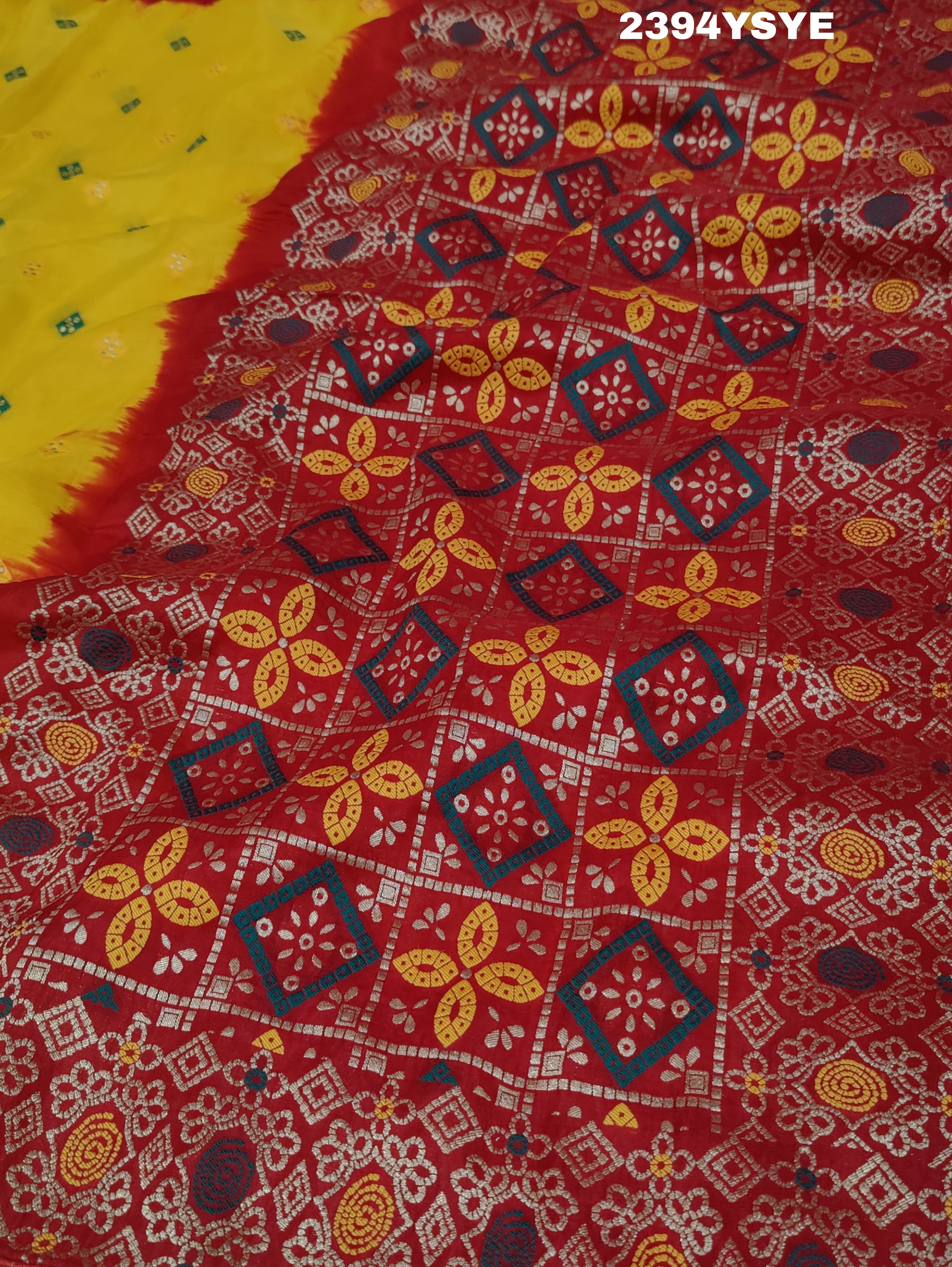 A yellow and red Dola silk saree with Zari weaving and a floral pattern,