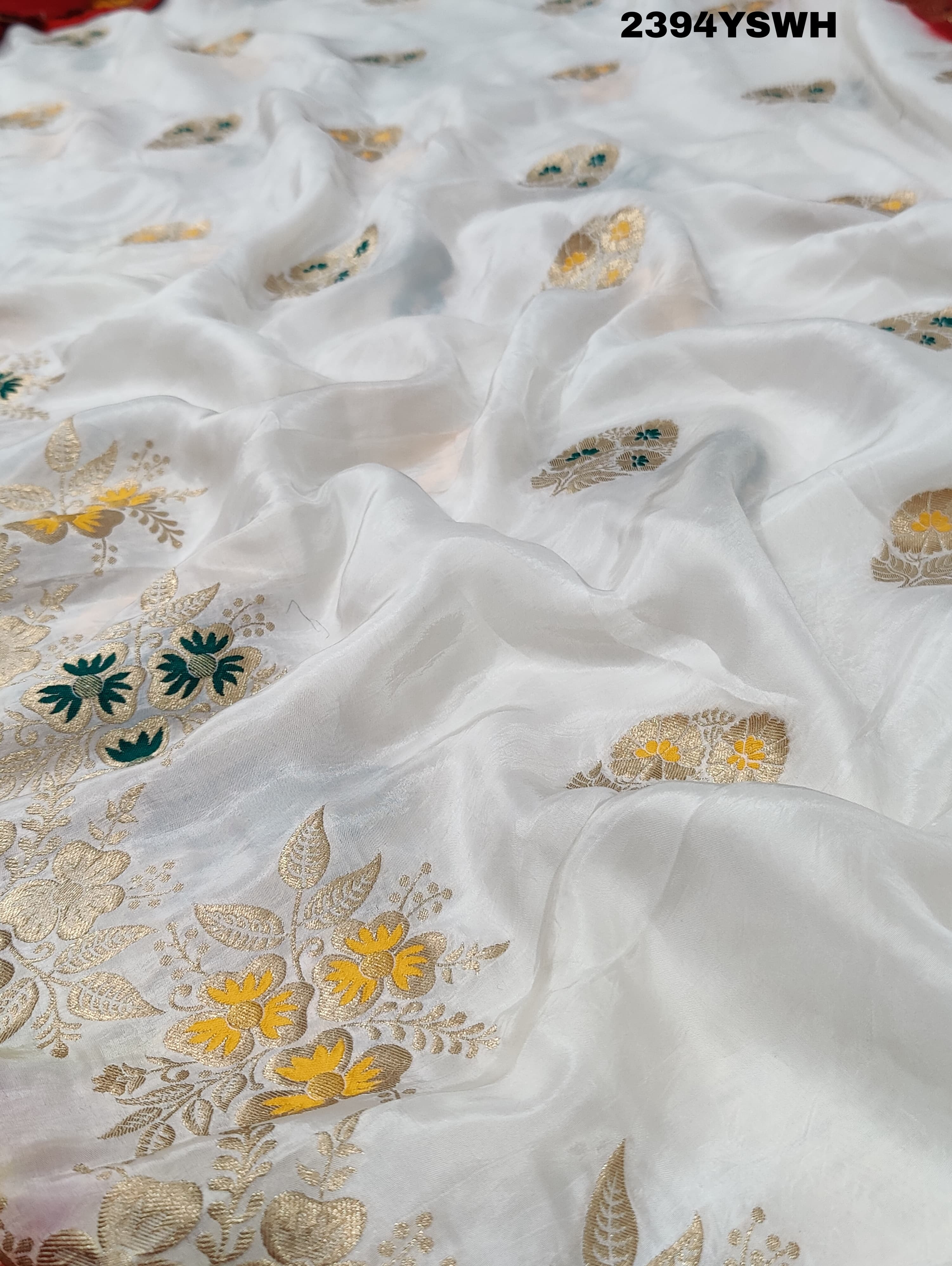 A Banarasi style saree with zari weaving, showcasing both the intricate detailing and the fabric's texture.