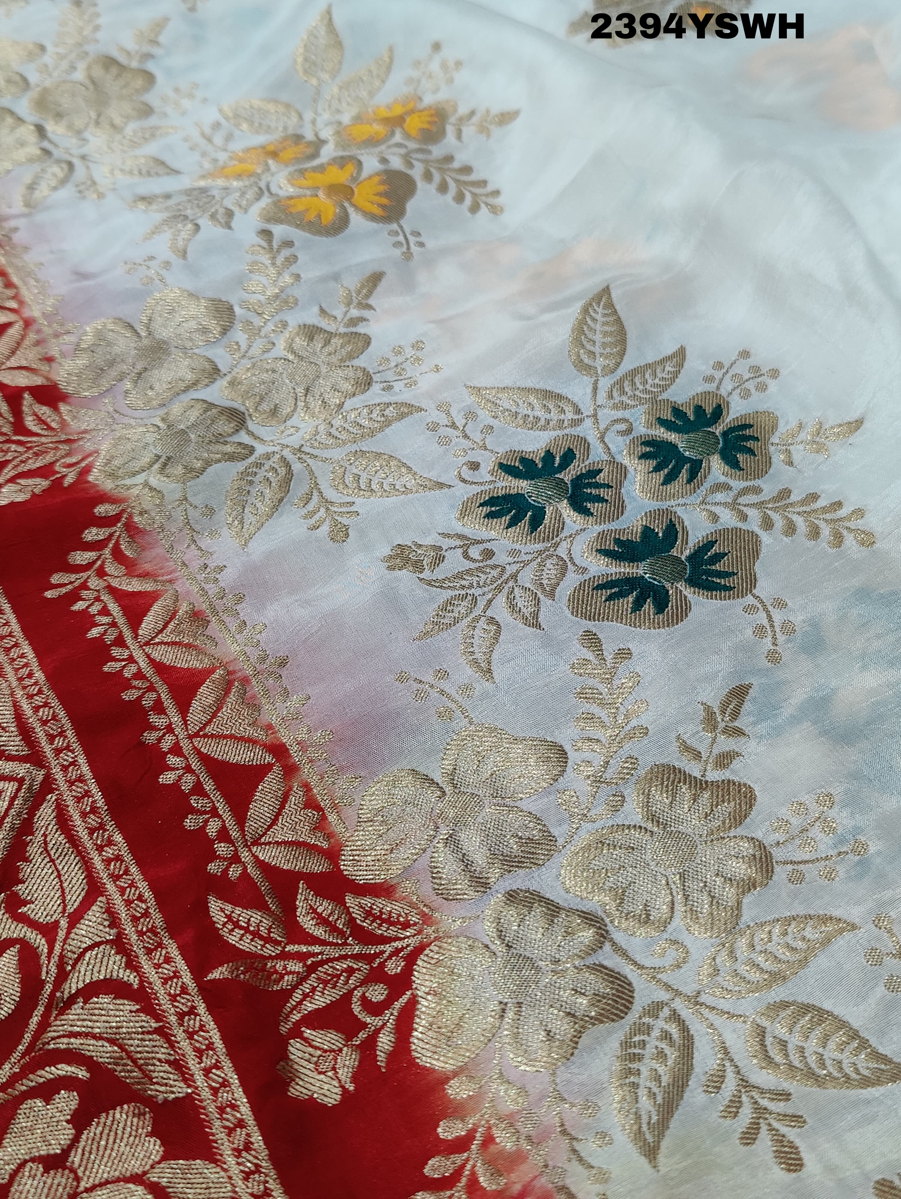 A Banarasi style saree with zari weaving, showcasing both the intricate detailing and the fabric's texture.
