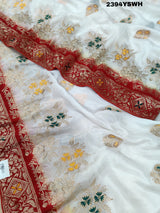 A Banarasi style saree with zari weaving, showcasing both the intricate detailing and the fabric's texture.