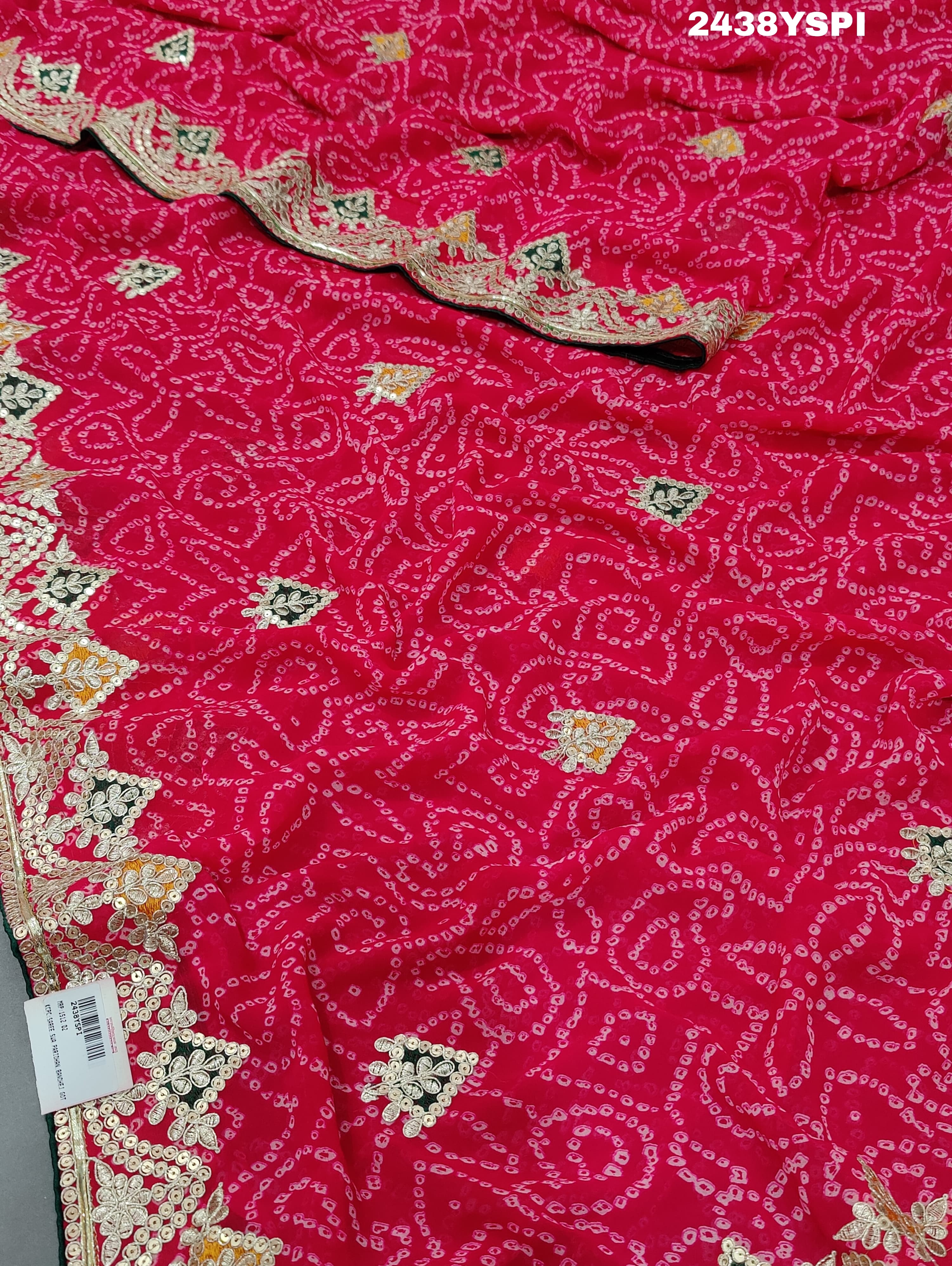 A pink chiffon saree with bandhani pattern and gotapatti work