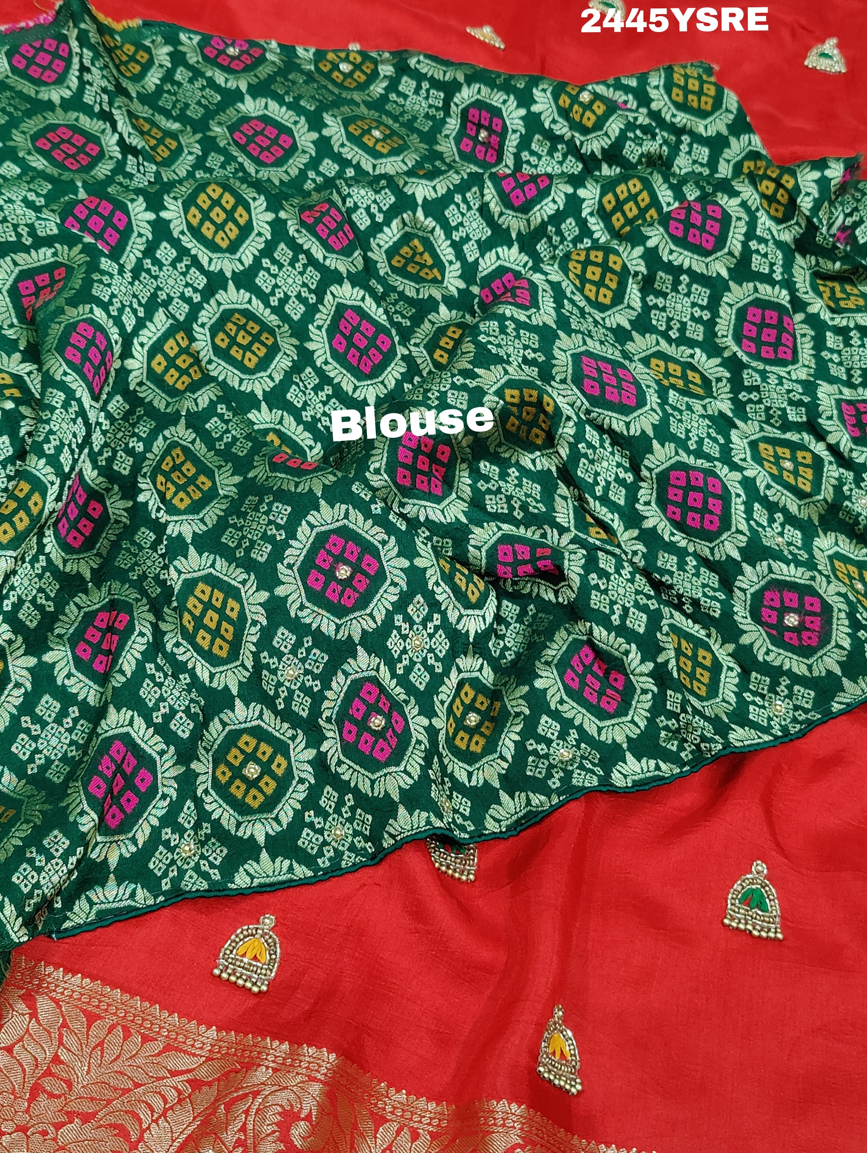 A red Banarasi silk saree with cutdana work and a golden border,