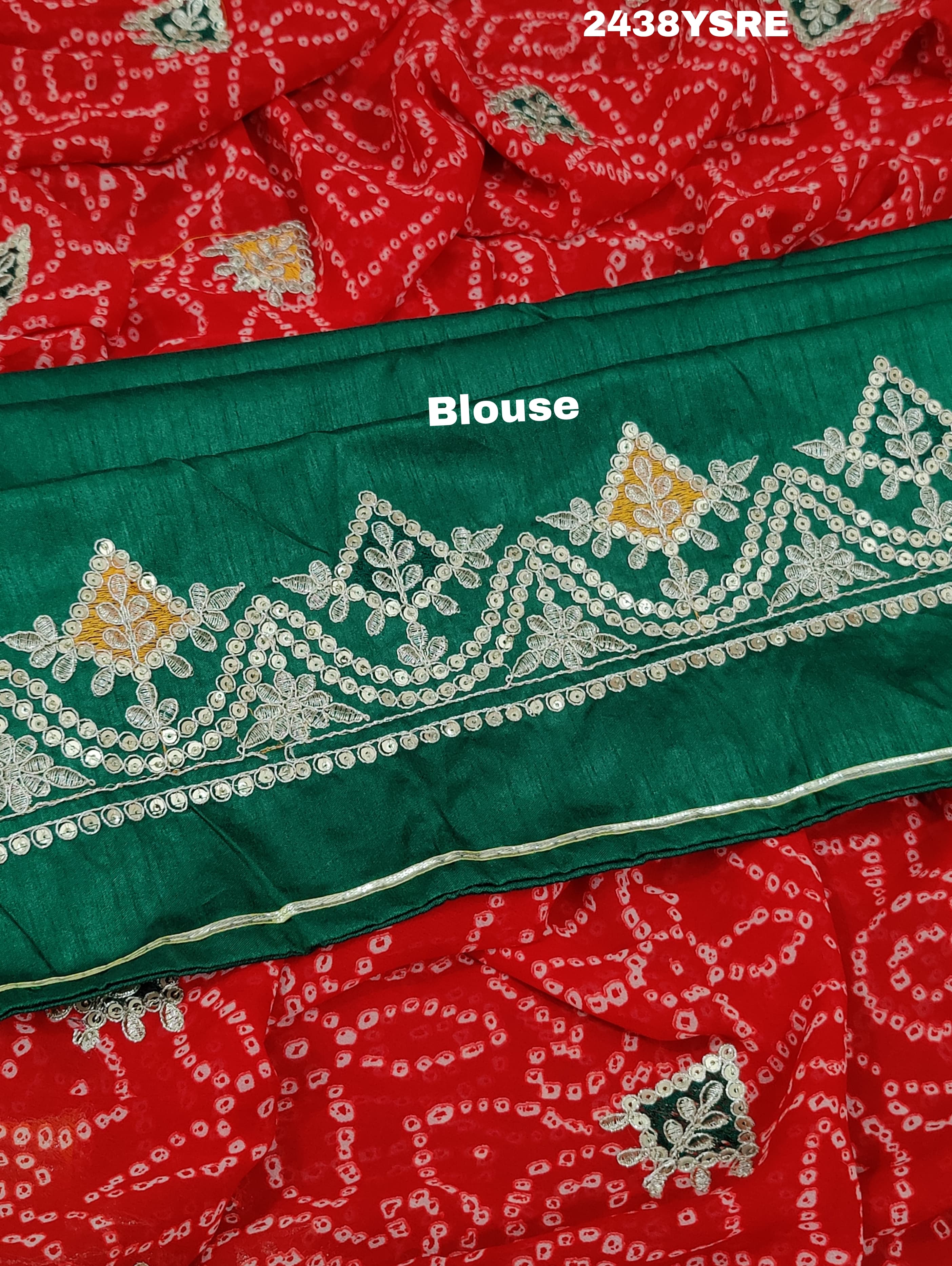 A red chiffon saree with bandhani pattern and gotapatti work