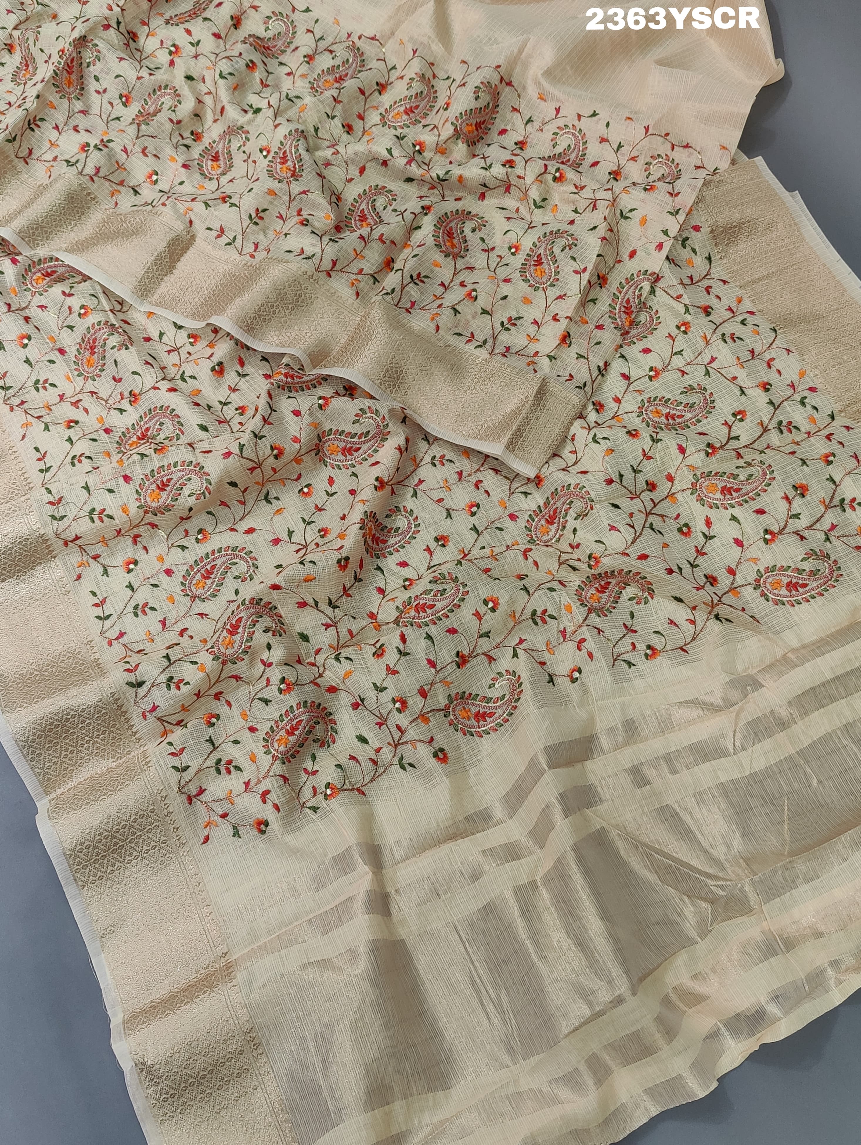 A cream-colored Kota Doriya saree with floral pattern