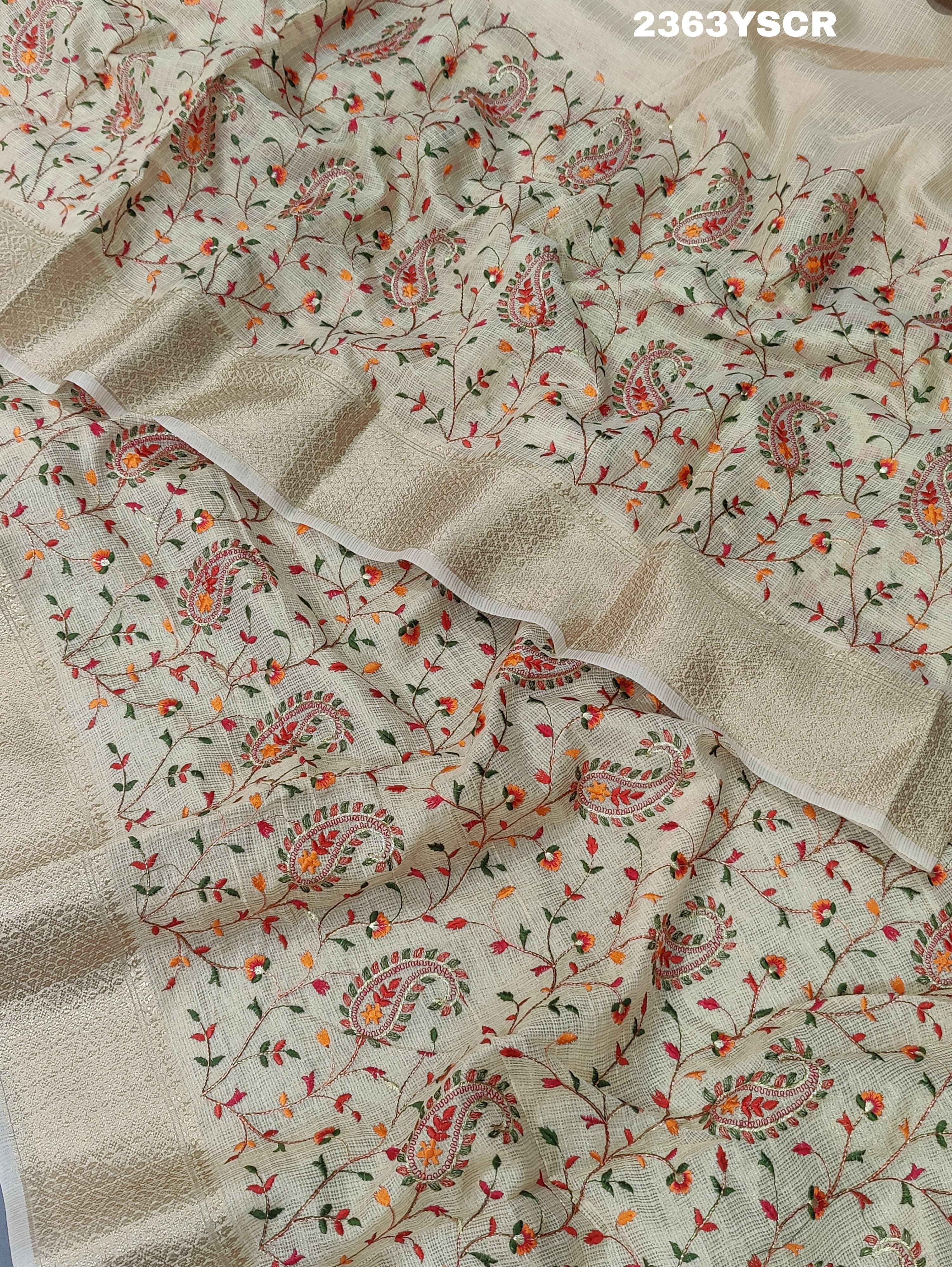 A cream-colored Kota Doriya saree with floral pattern