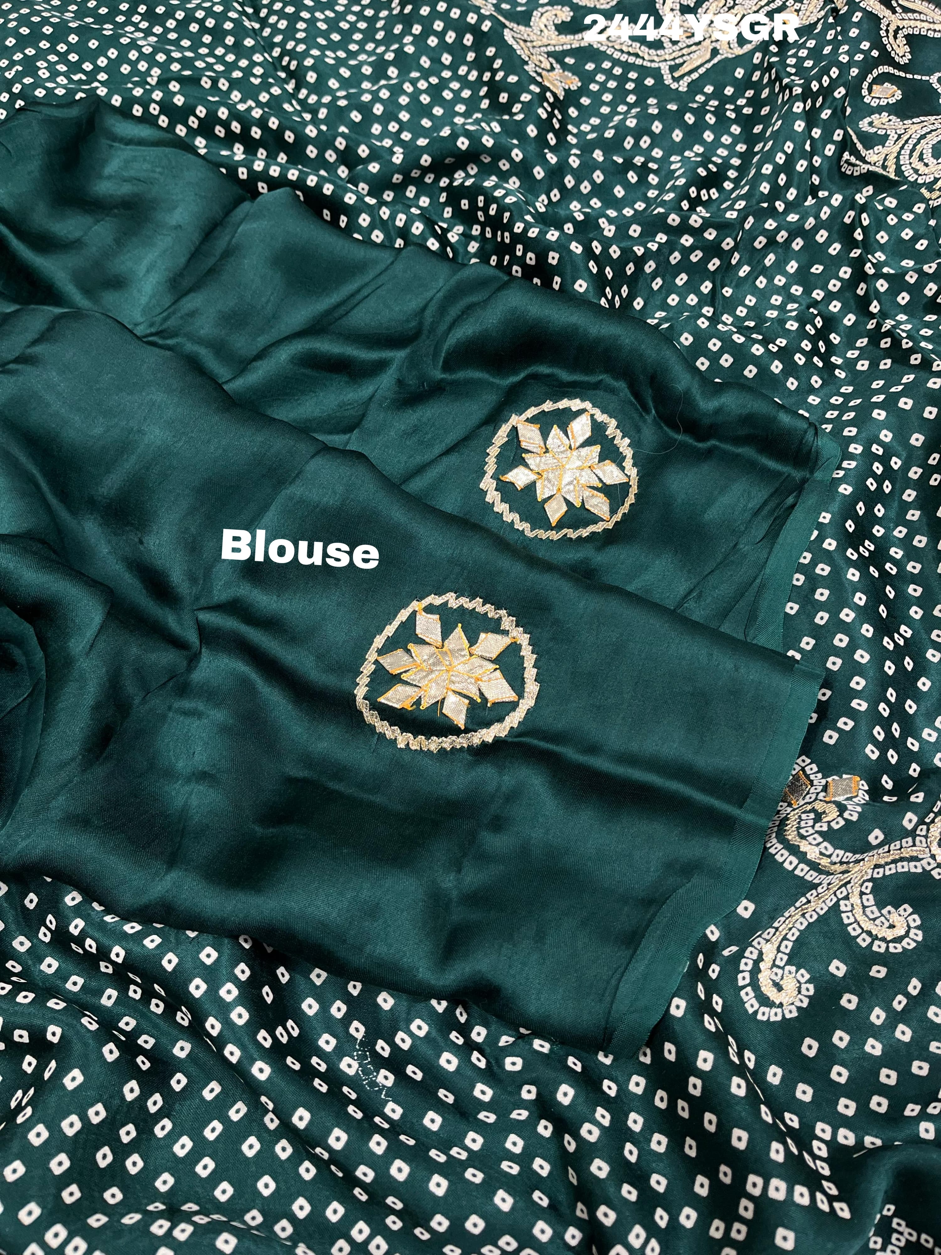 A green modal silk saree with bandhani style patterns and gotapatti work