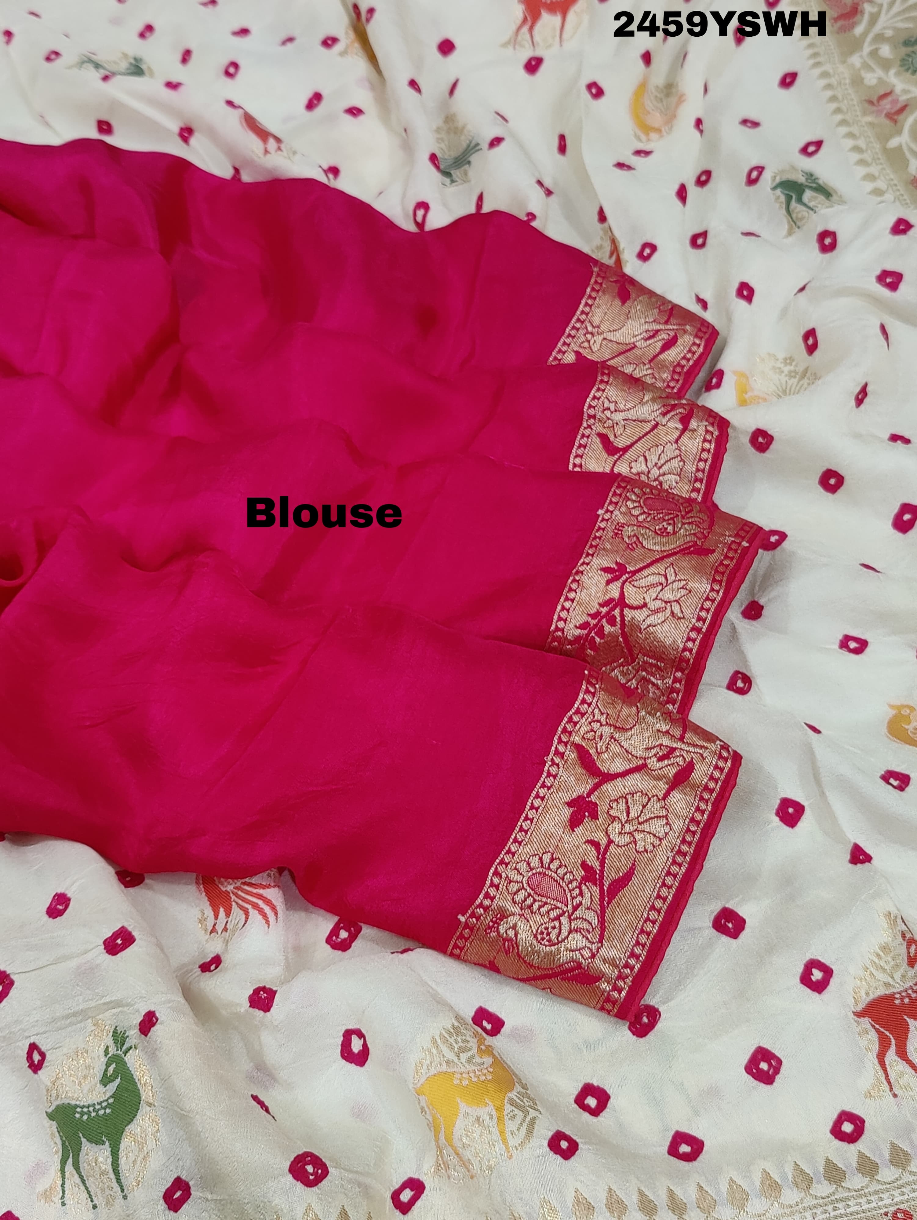A Chinon silk saree with a Kalamkari style pattern, featuring a white base with multicolored floral designs and zari weaving details