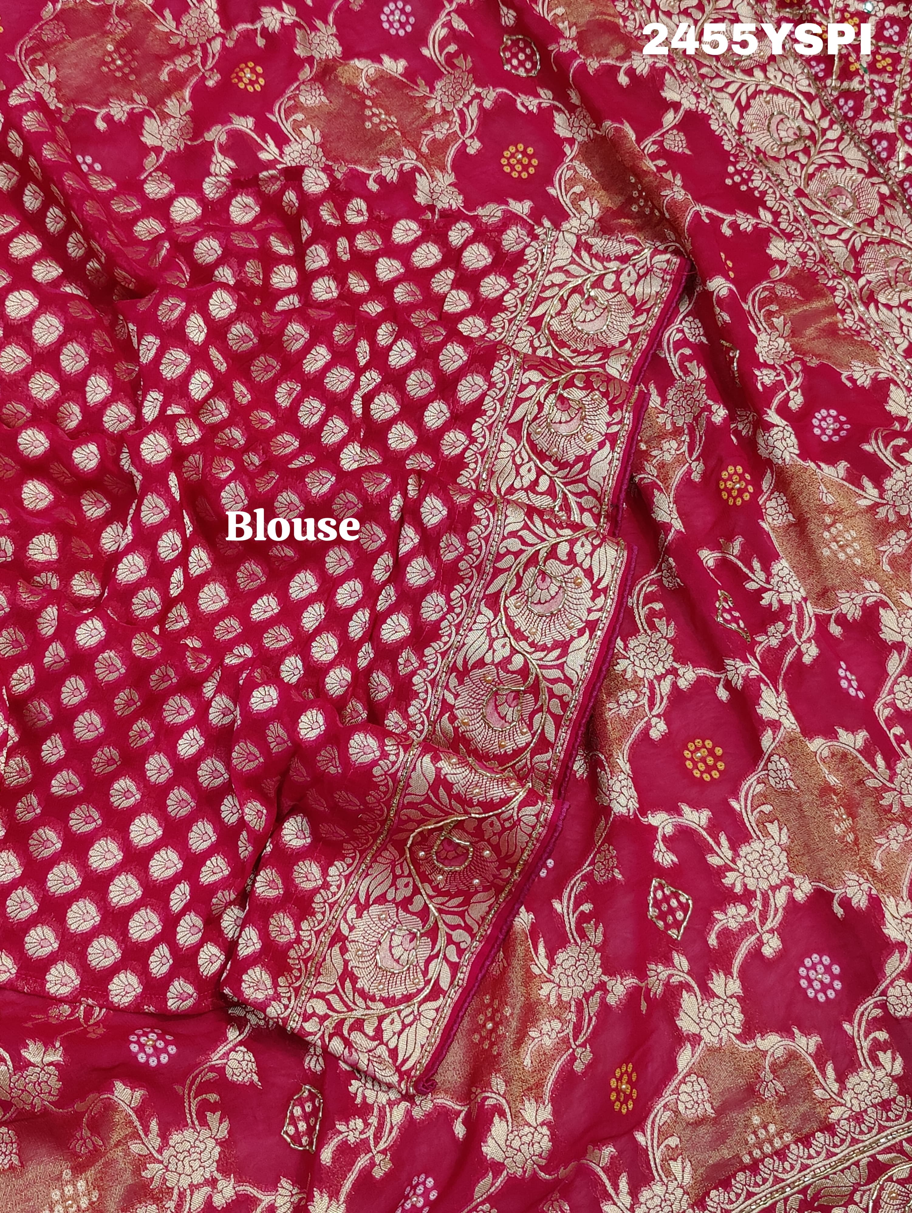 A Banarasi style saree with cutdana work, predominantly pink with gold geometric patterns