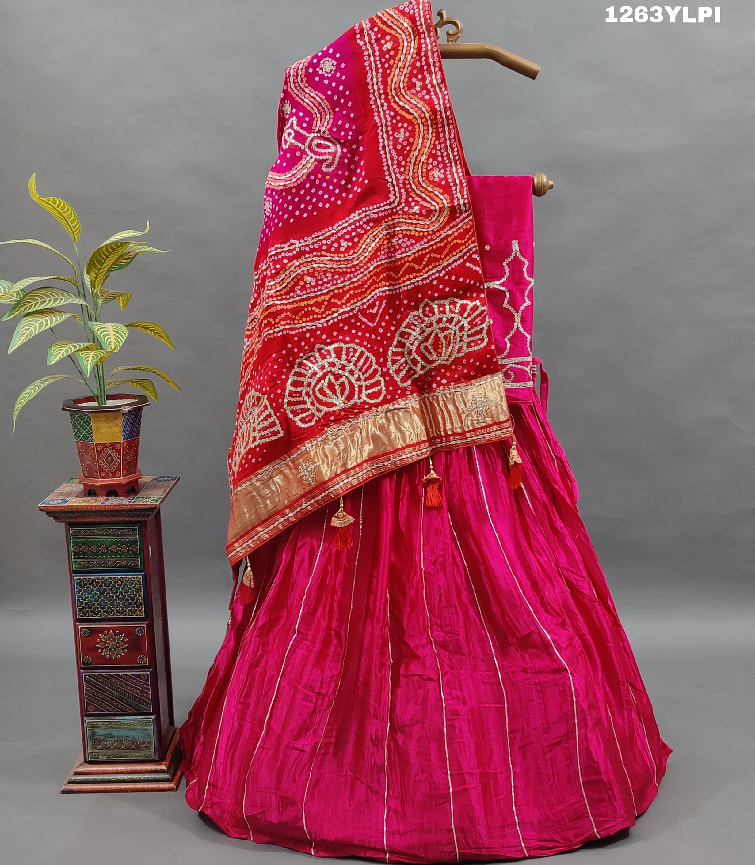 A pure gaji silk lehenga in pink with heavy gota patti work