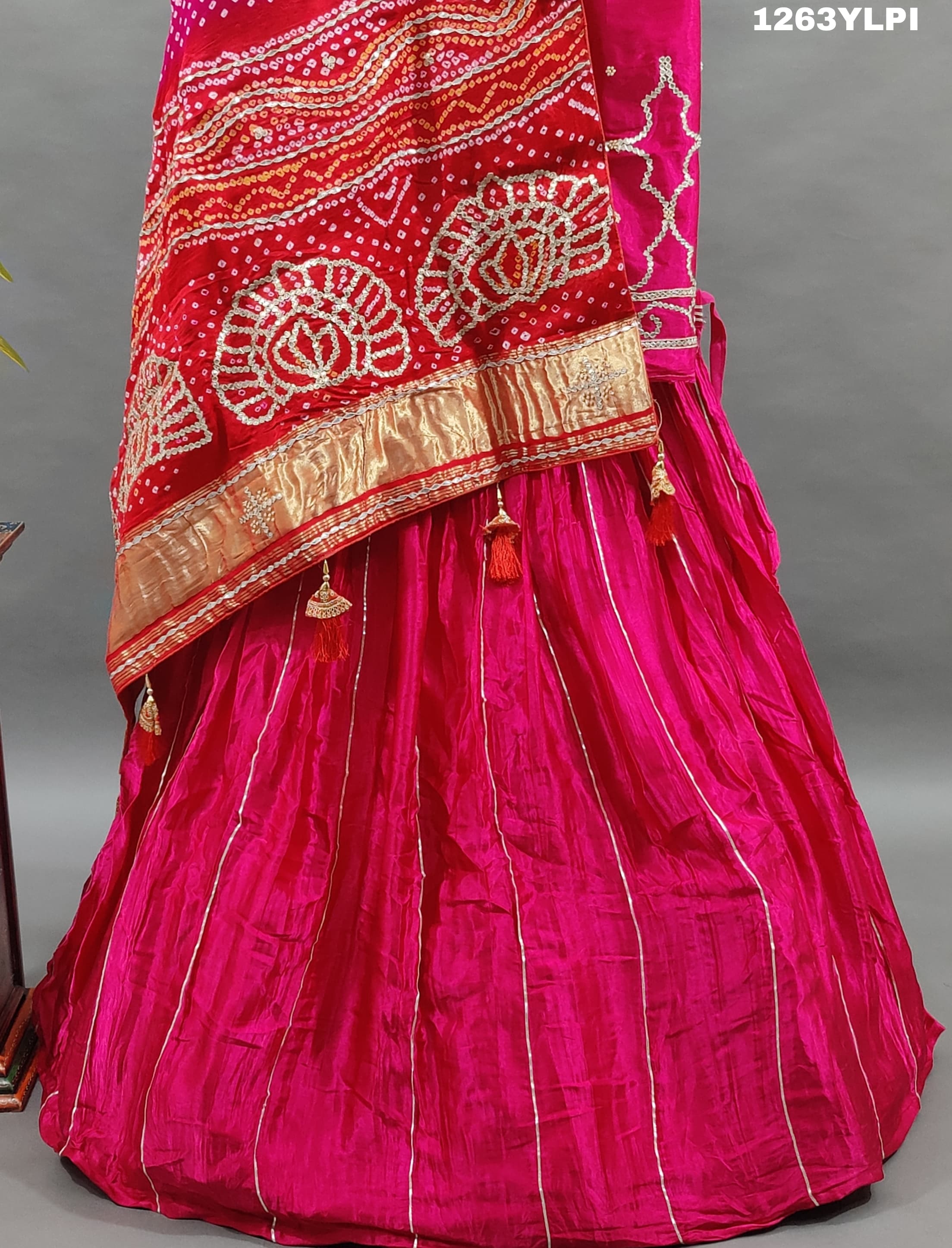 A pure gaji silk lehenga in pink with heavy gota patti work
