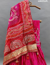 A pure gaji silk lehenga in pink with heavy gota patti work