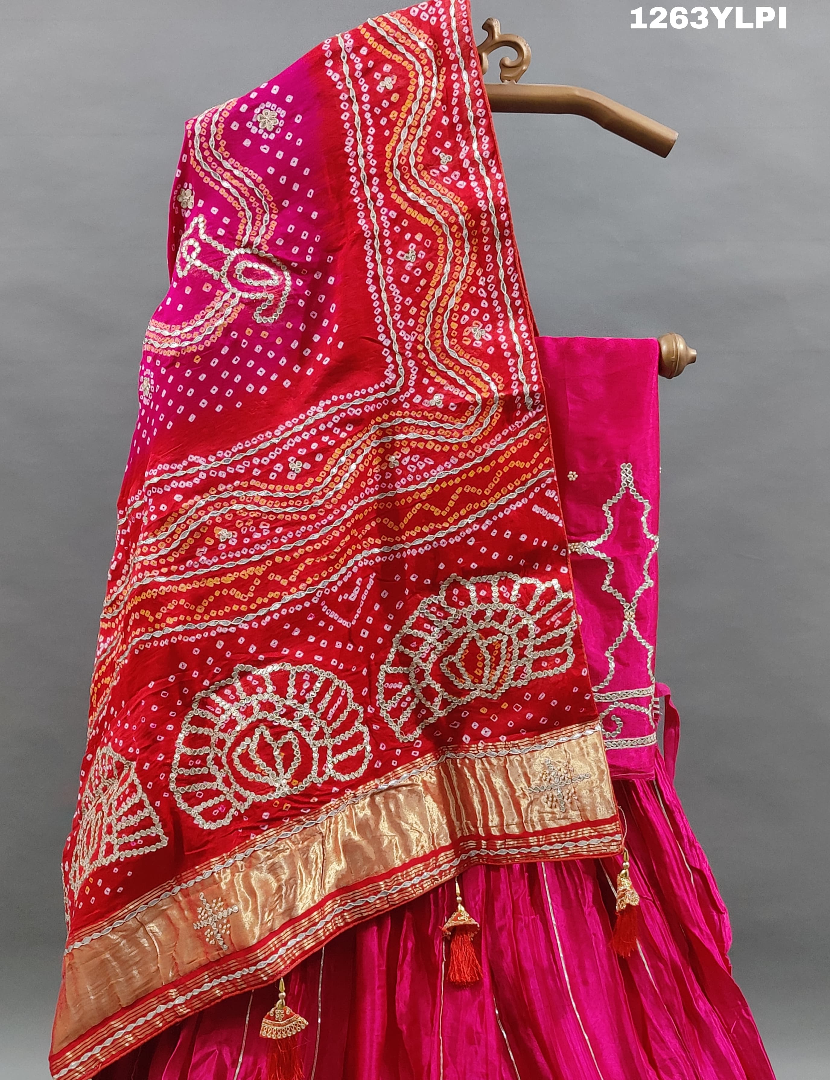 A pure gaji silk lehenga in pink with heavy gota patti work
