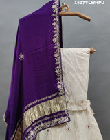 A traditional white lehenga Zardoji Gotapatti embroidery