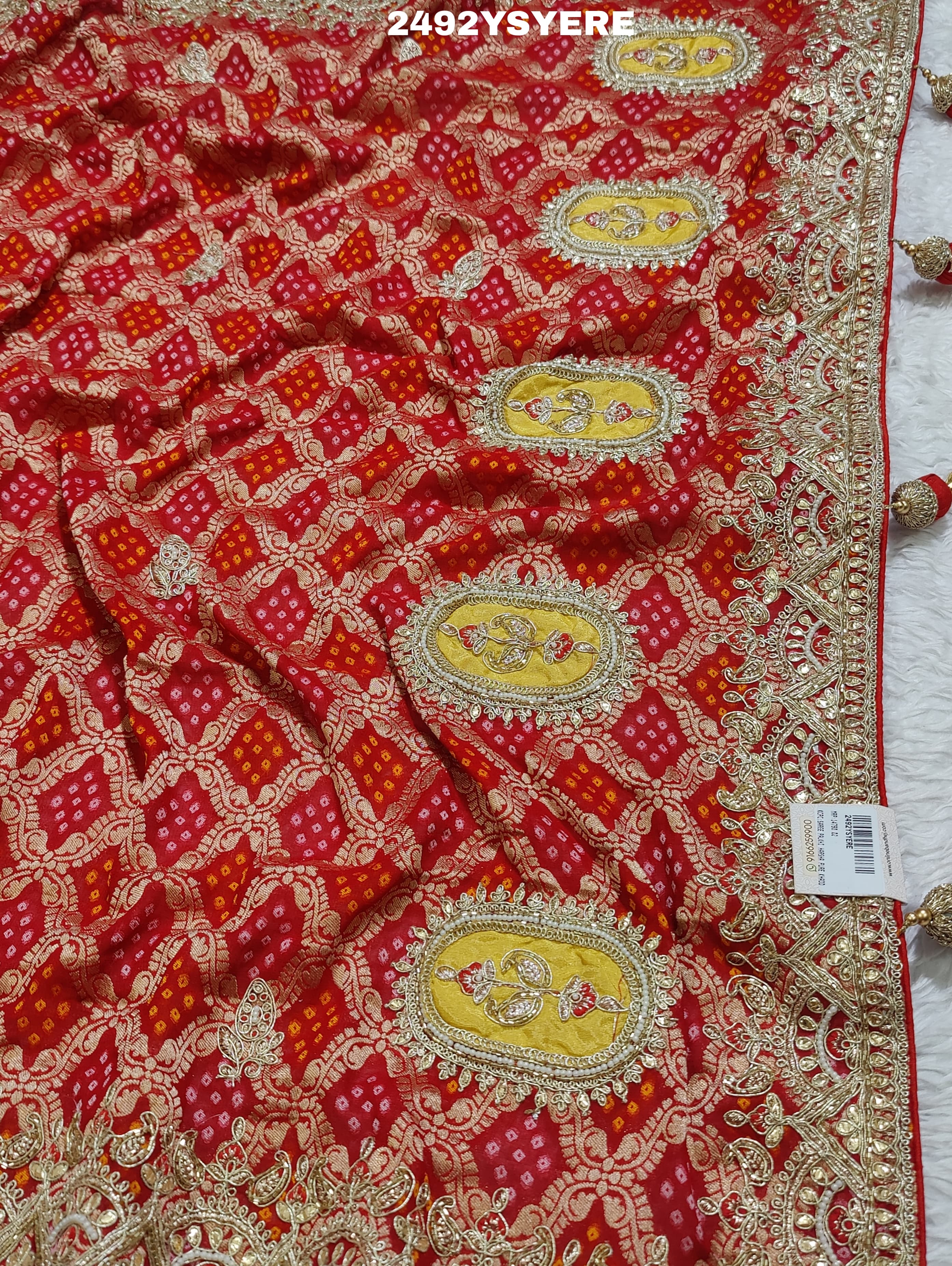 A Banarasi silk saree with sequence embroidery work, featuring a design in yellow and red patterns