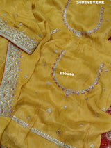 A Banarasi silk saree with sequence embroidery work, featuring a design in yellow and red patterns