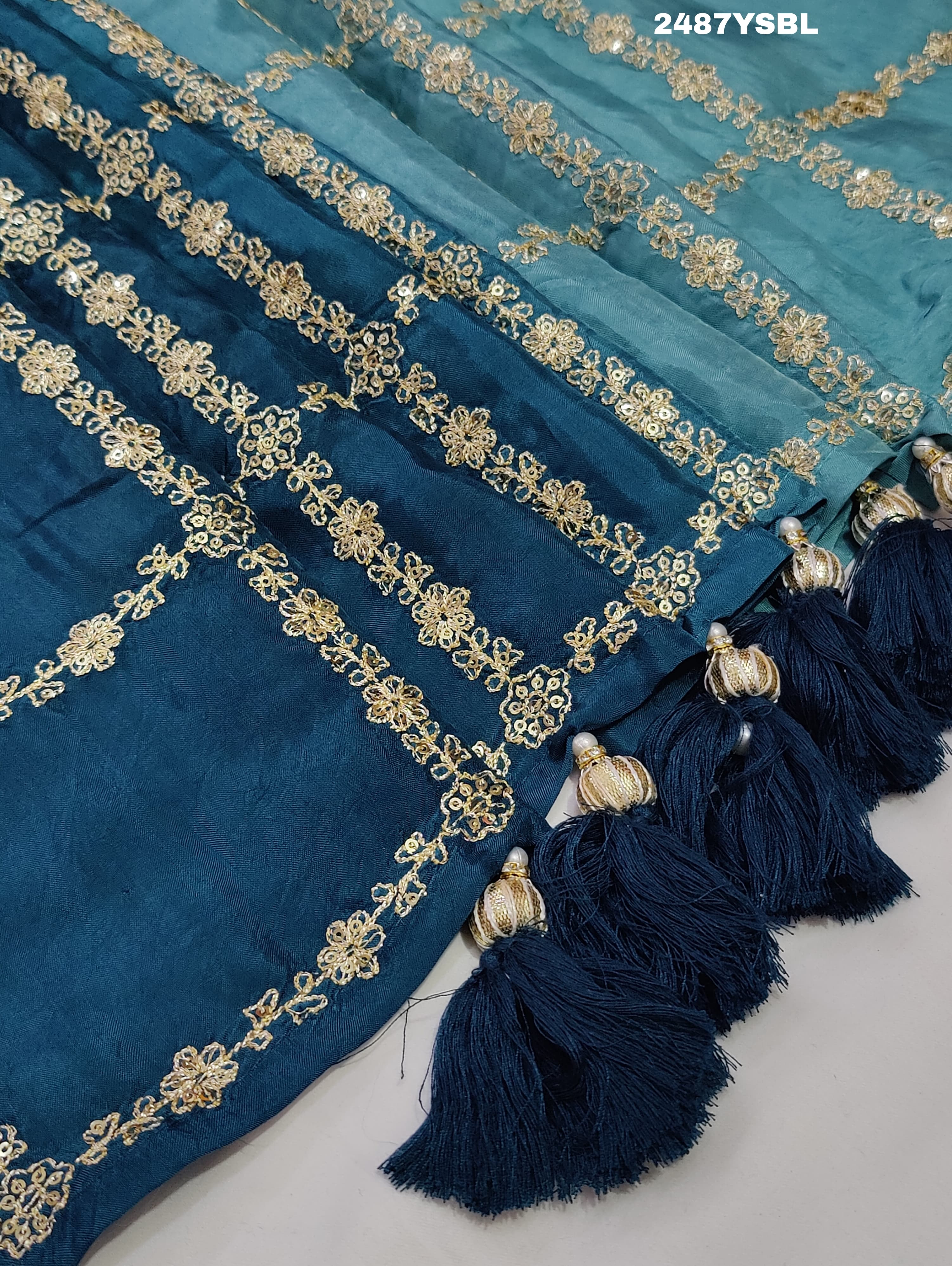 A blue saree with geometric pitton work
