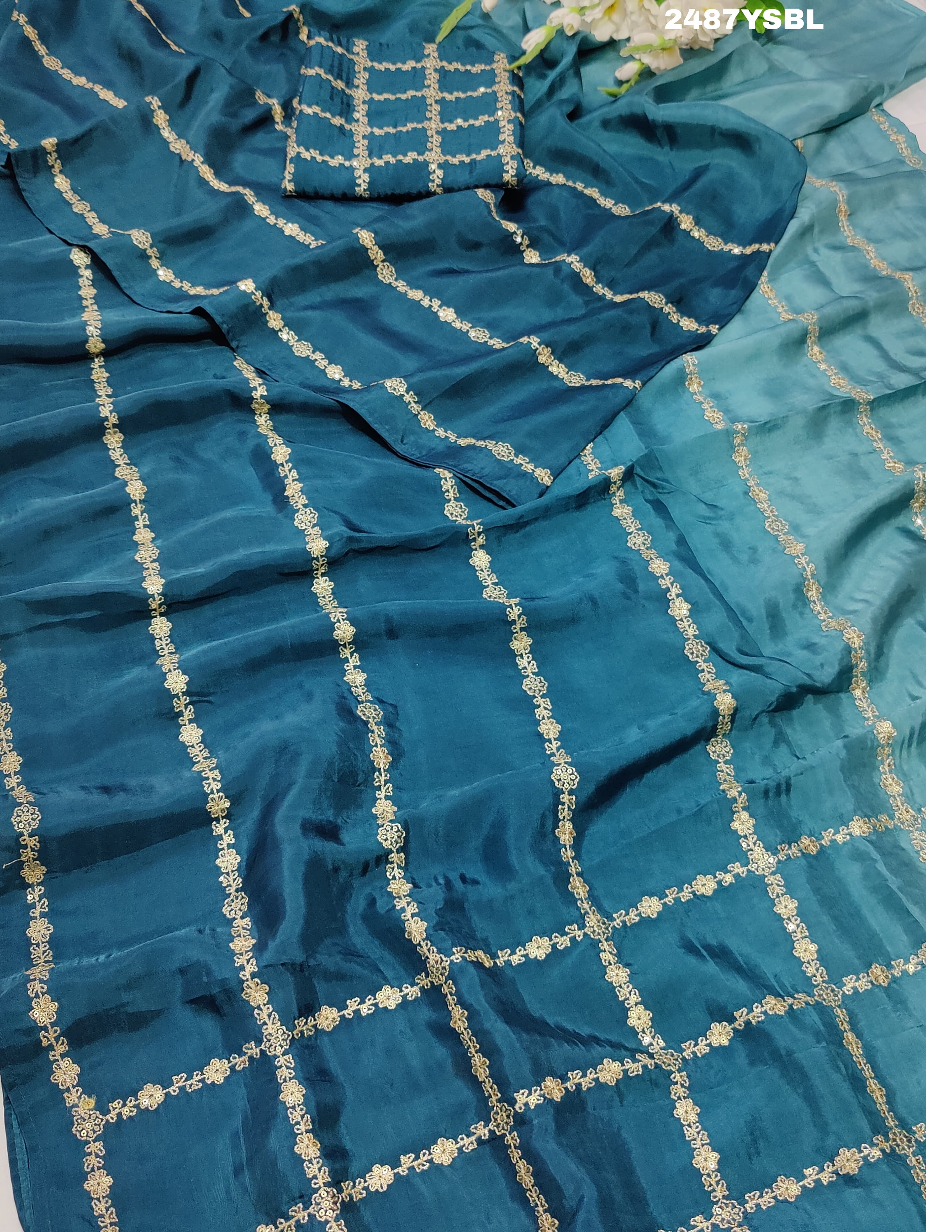 A blue saree with geometric pitton work
