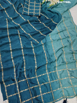 A blue saree with geometric pitton work