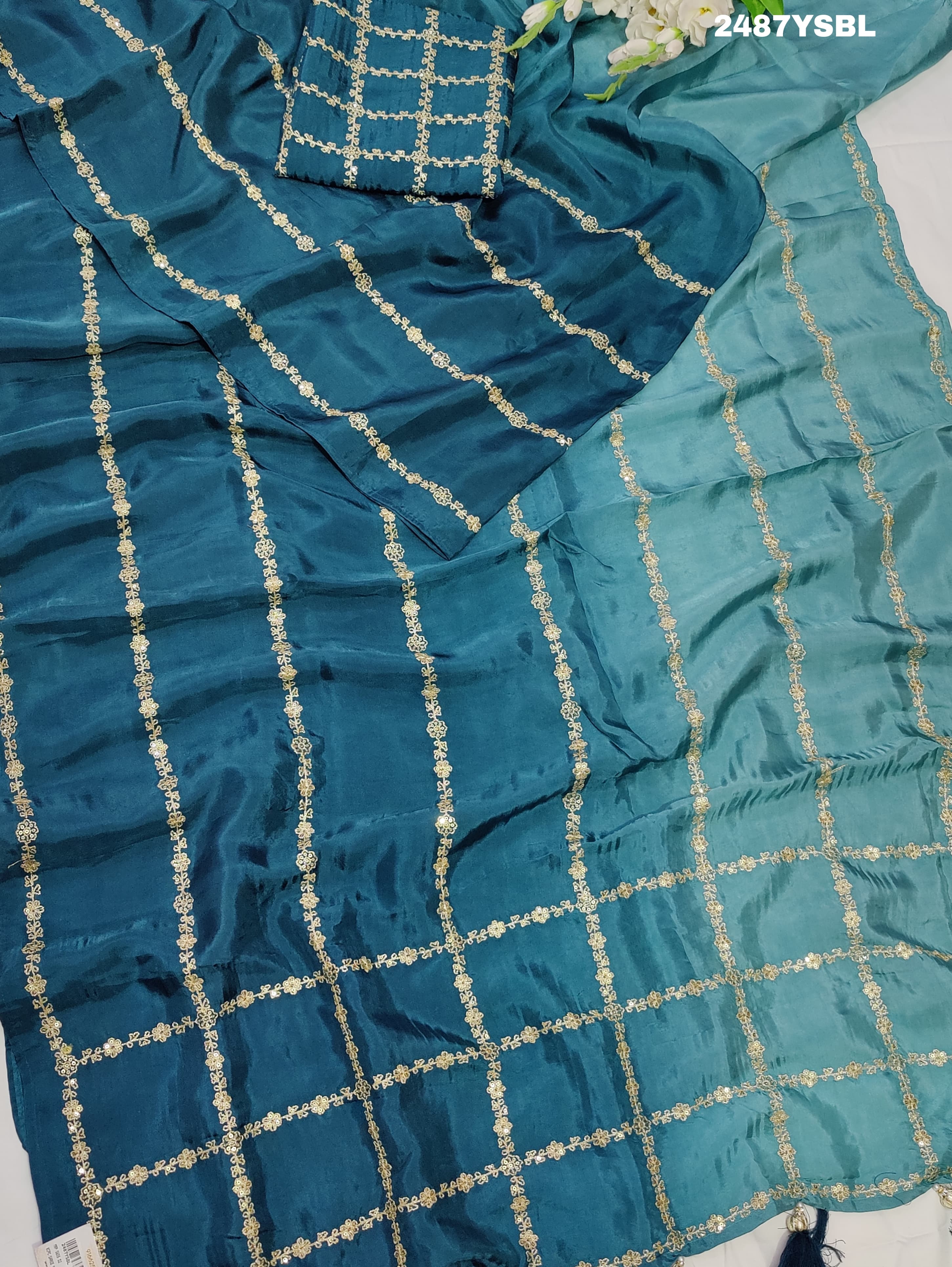 A blue saree with geometric pitton work