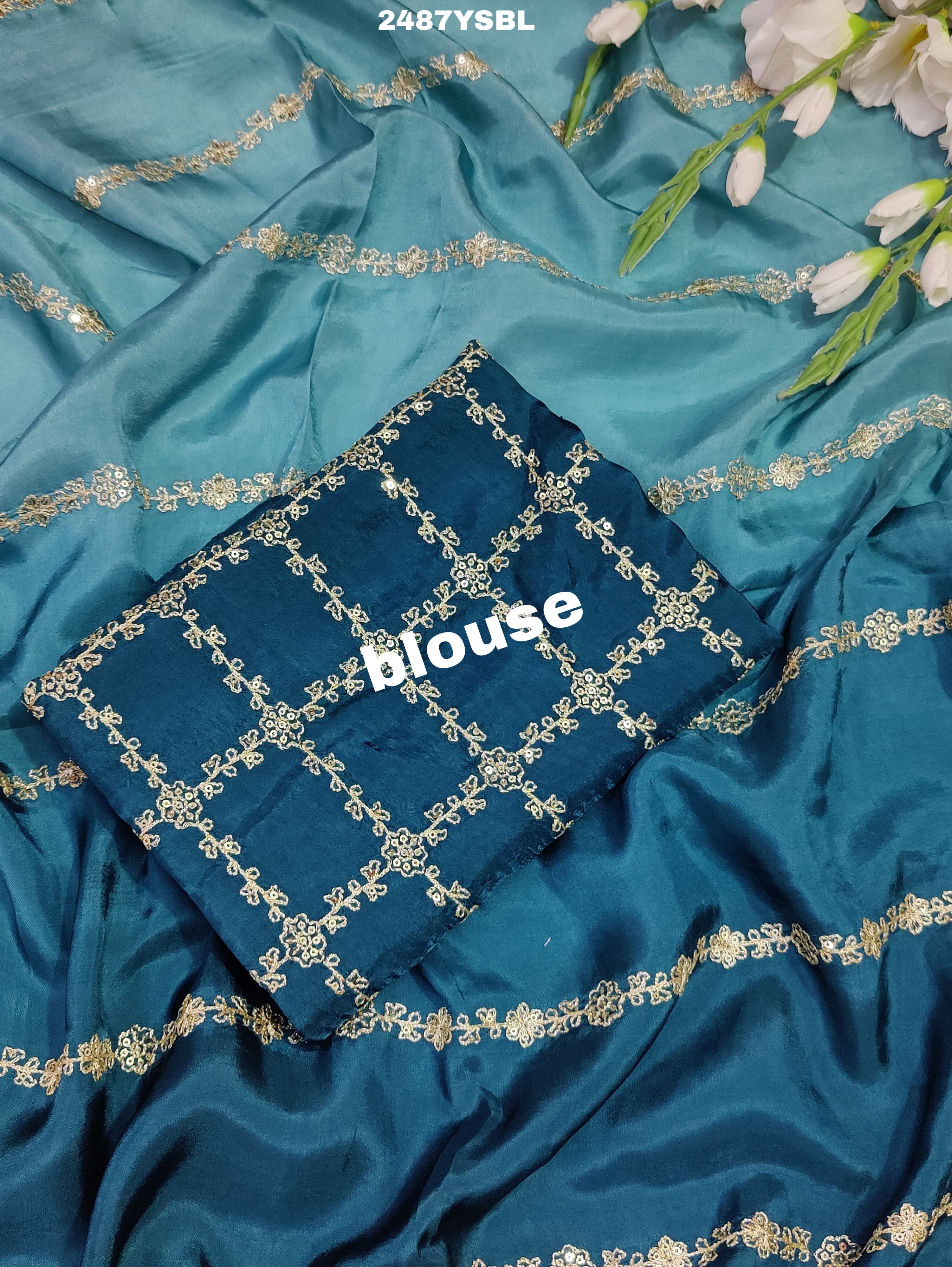 A blue saree with geometric pitton work