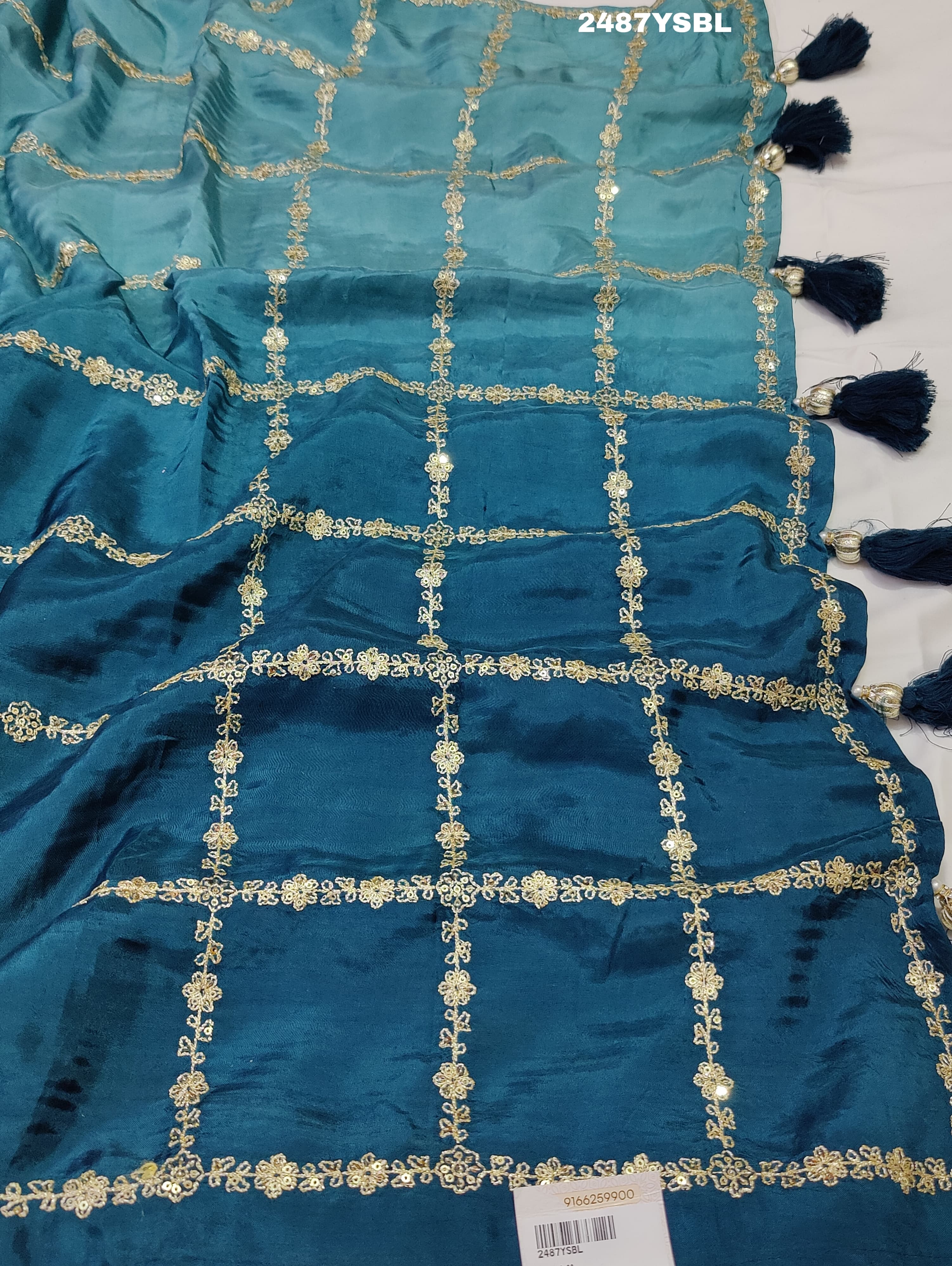 A blue saree with geometric pitton work
