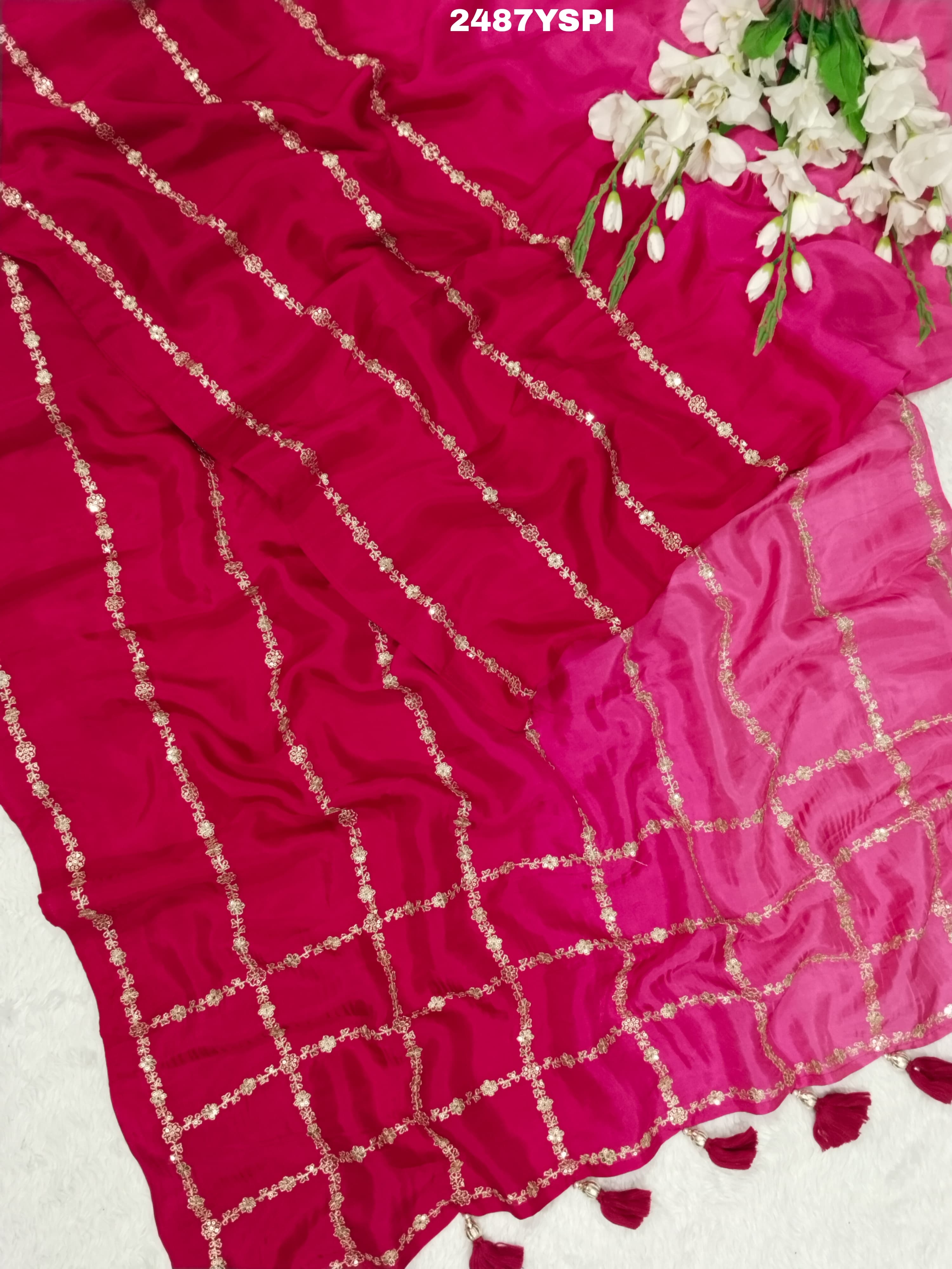 A pink saree with floral pitton work