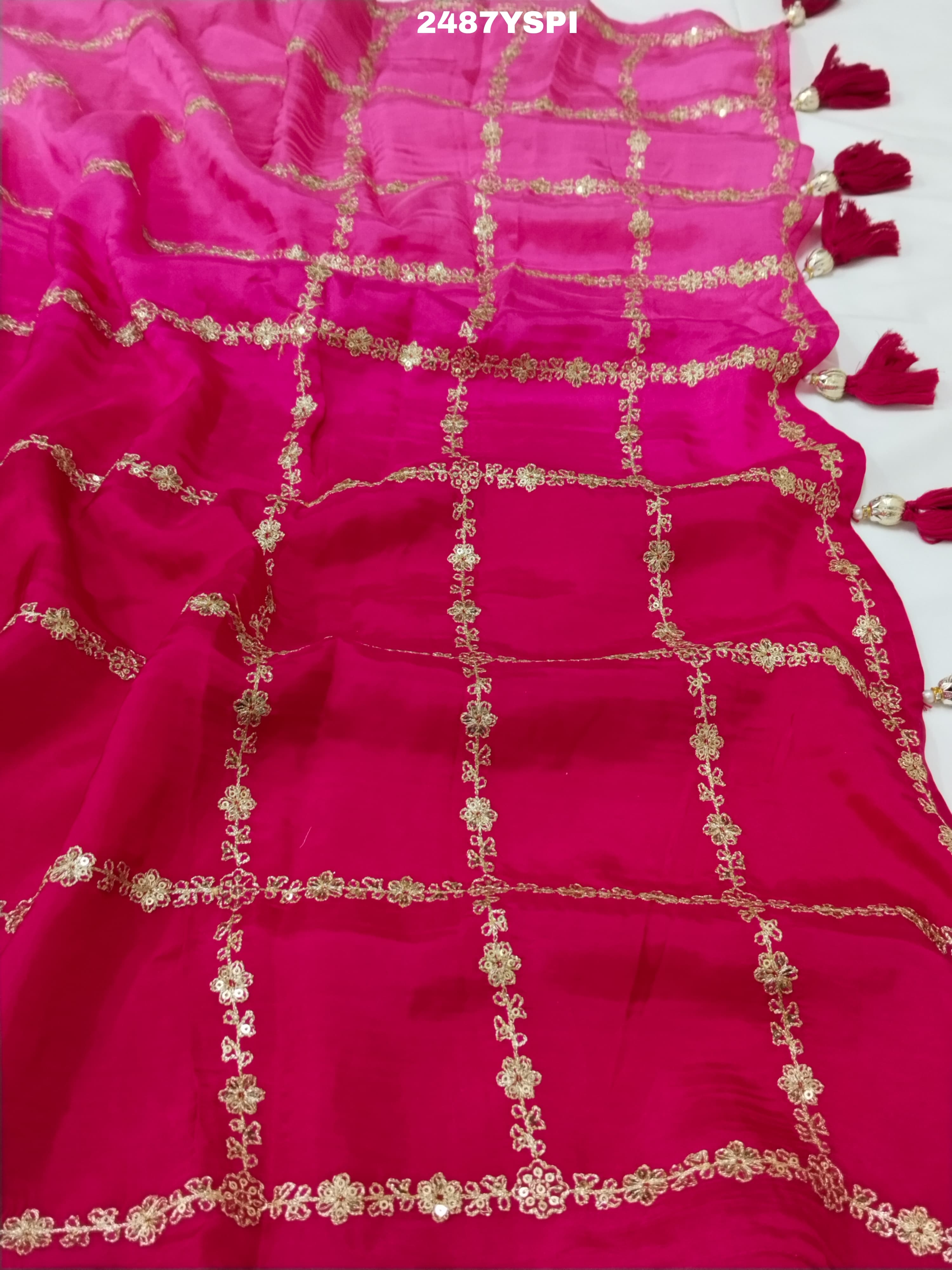 A pink saree with floral pitton work