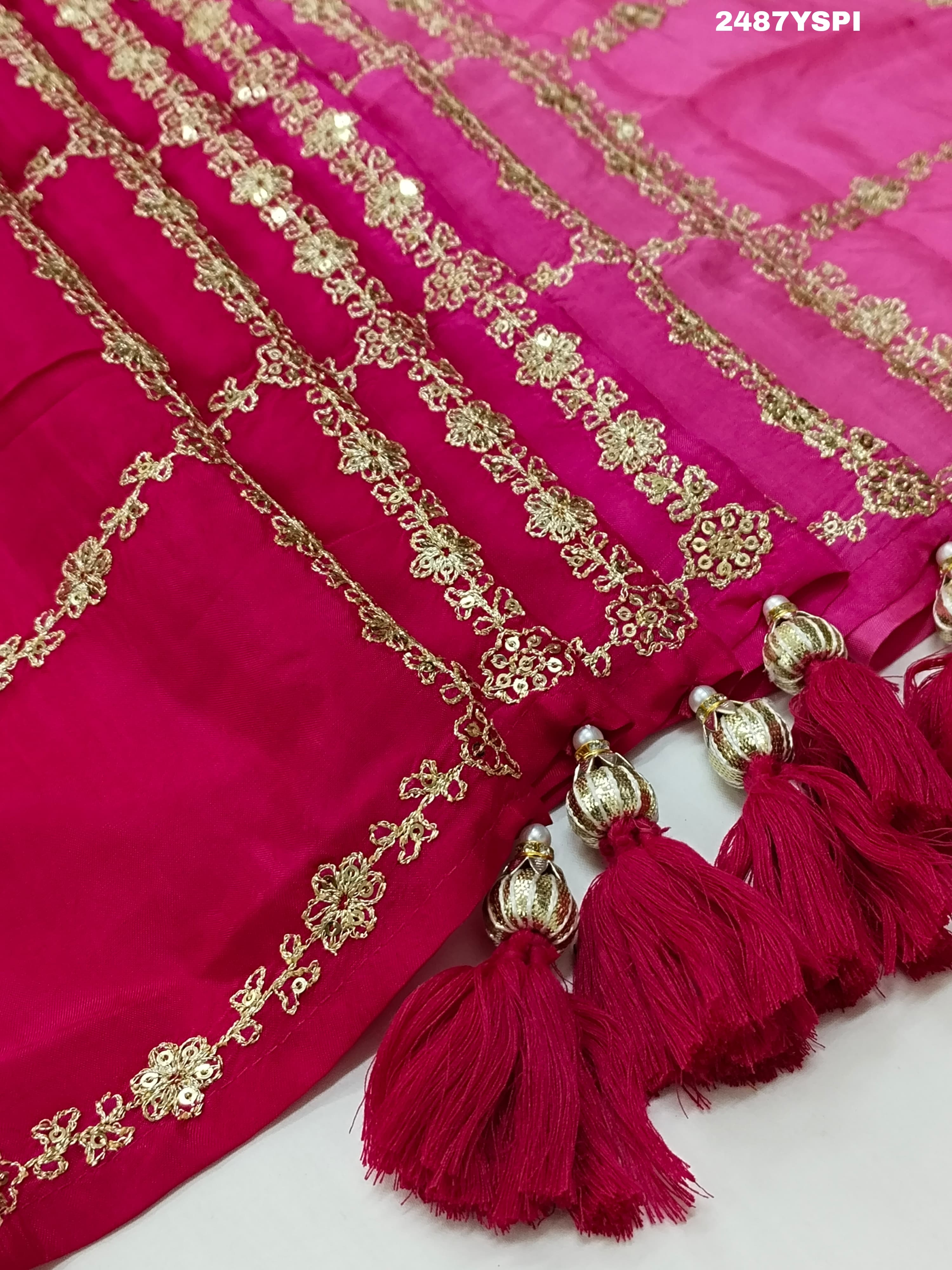 A pink saree with floral pitton work