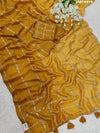 A yellow saree with floral pitton work