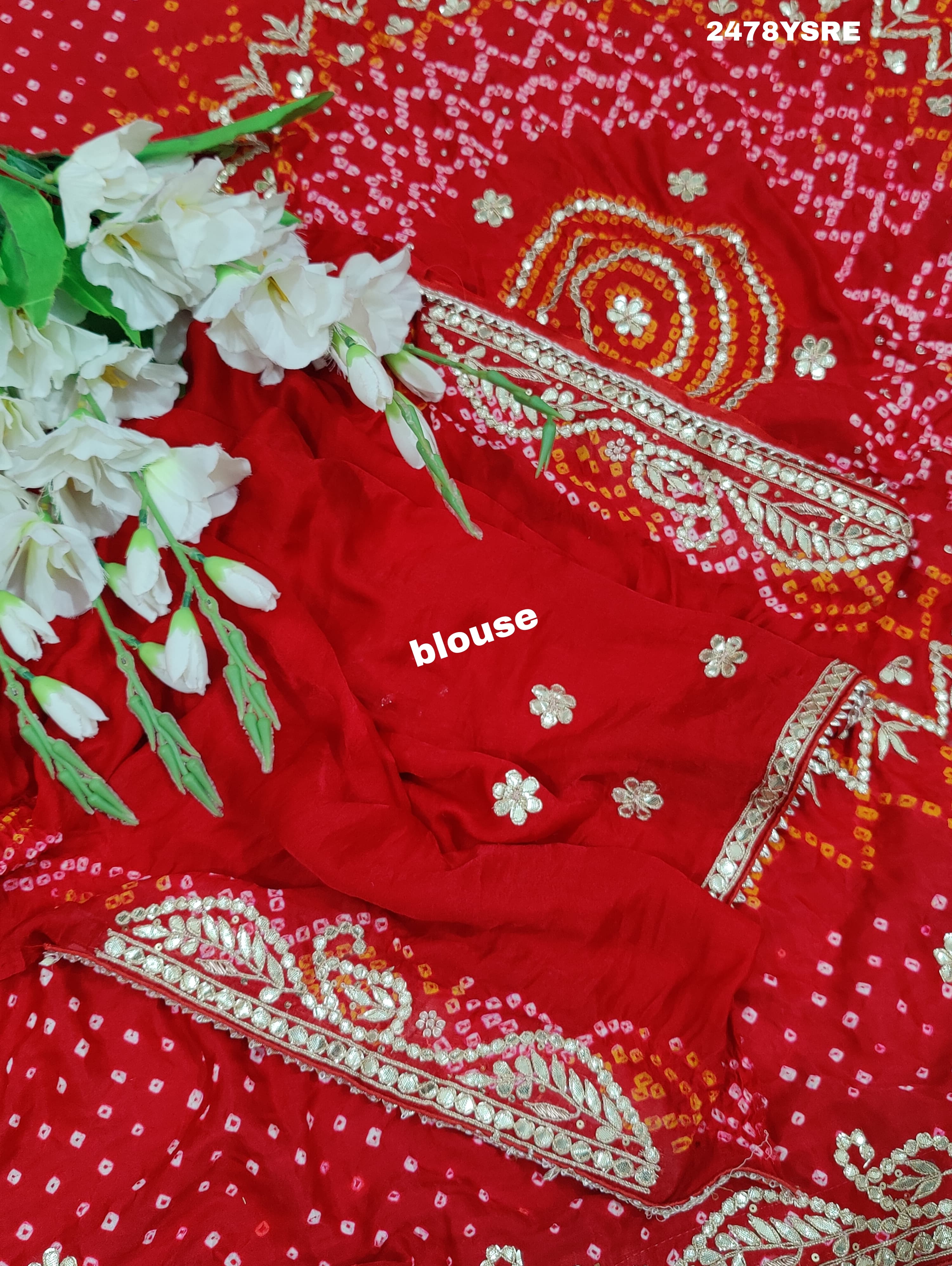 A red Gaji silk saree with Bandhani style embellishments and Gotapatti work