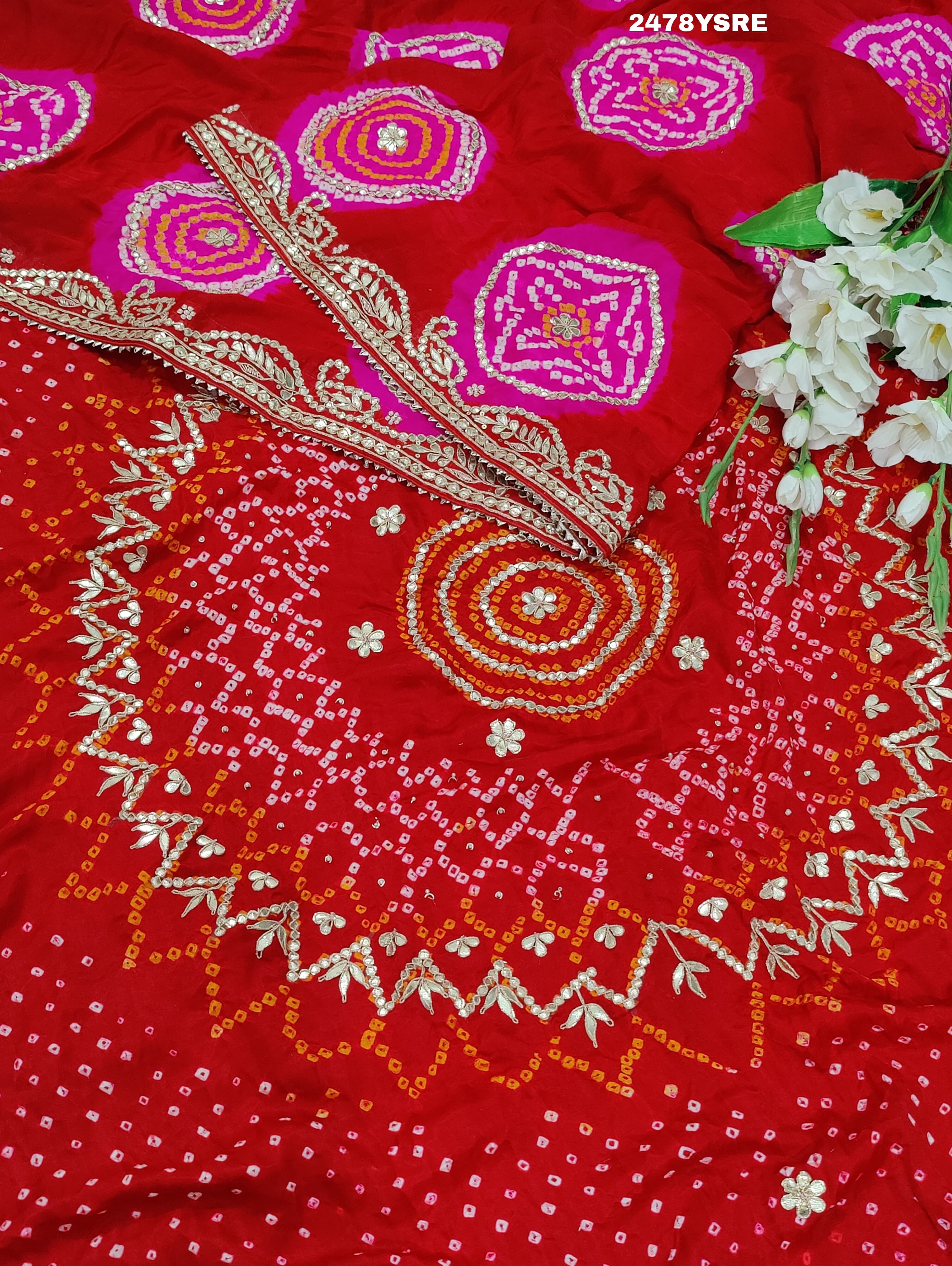 A red Gaji silk saree with Bandhani style embellishments and Gotapatti work