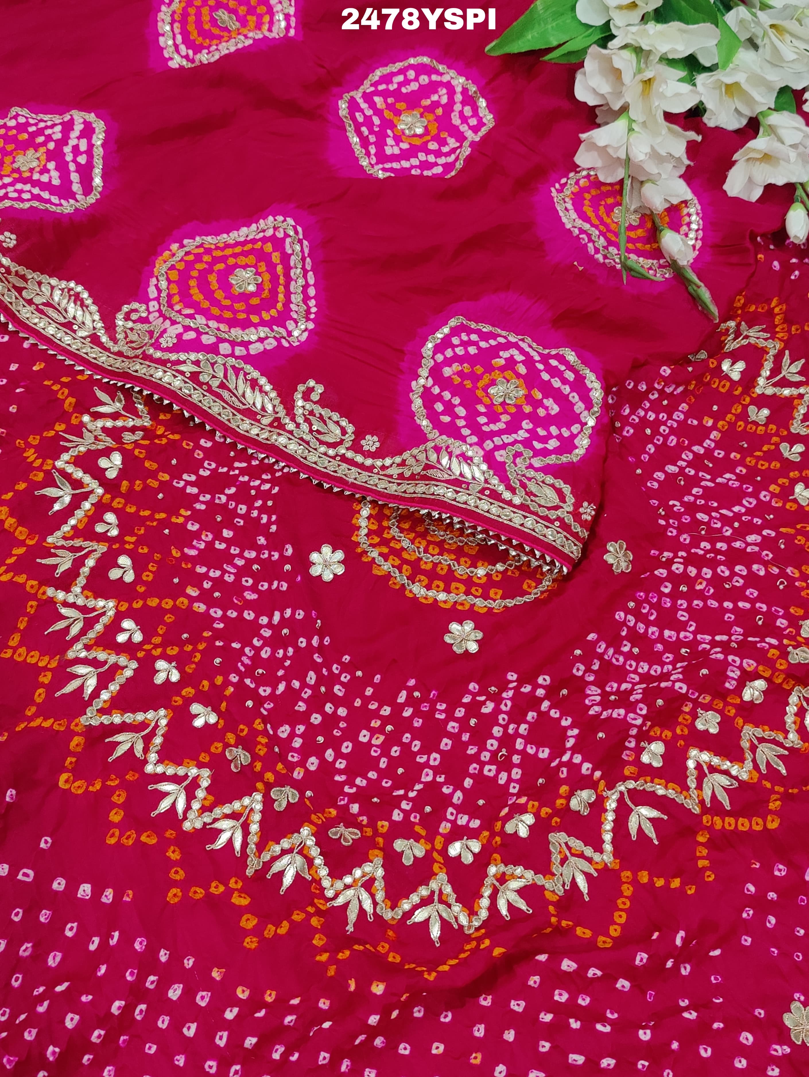A pink Gaji silk saree with Bandhani style embellishments and Gotapatti work