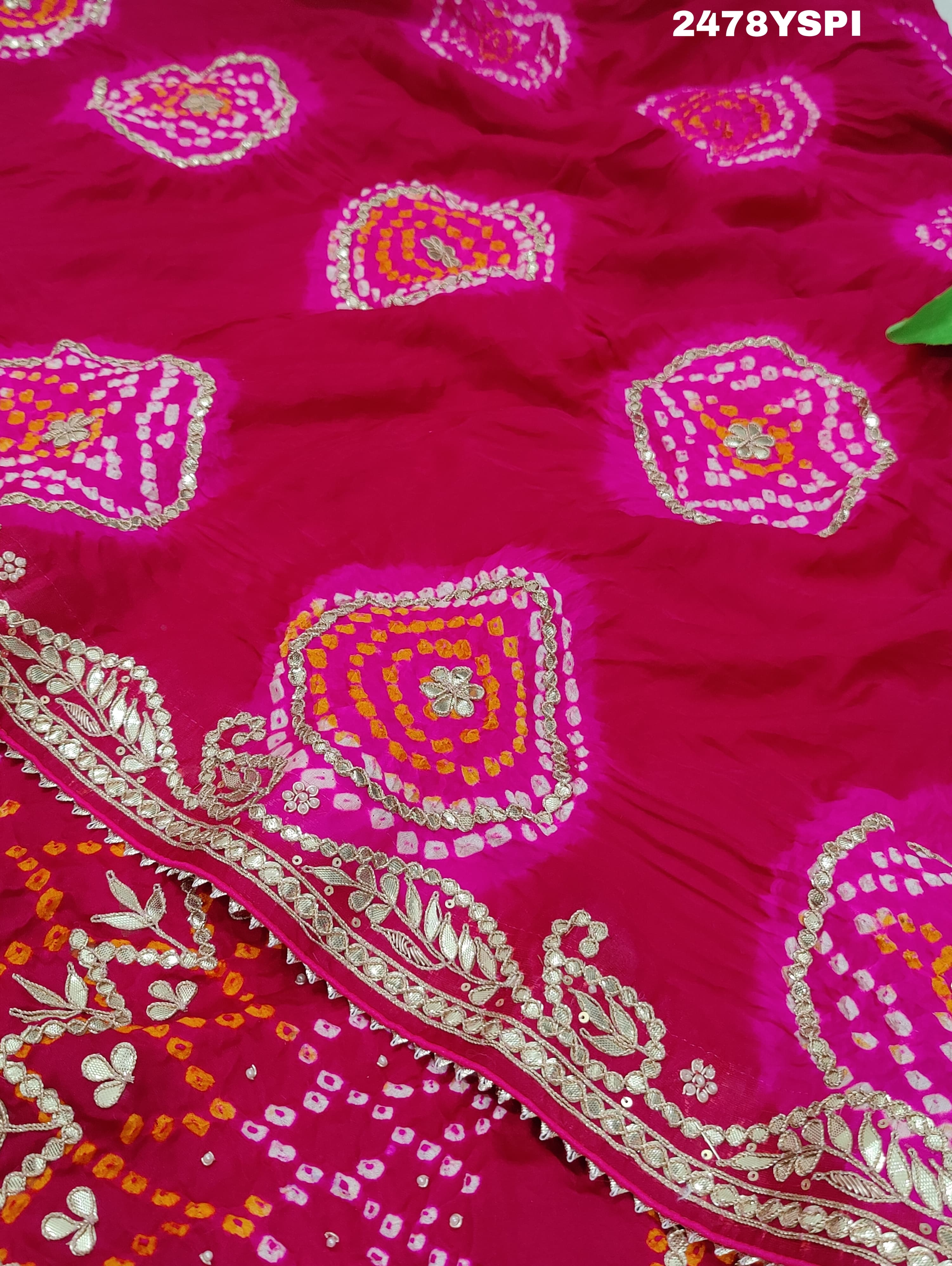 A pink Gaji silk saree with Bandhani style embellishments and Gotapatti work