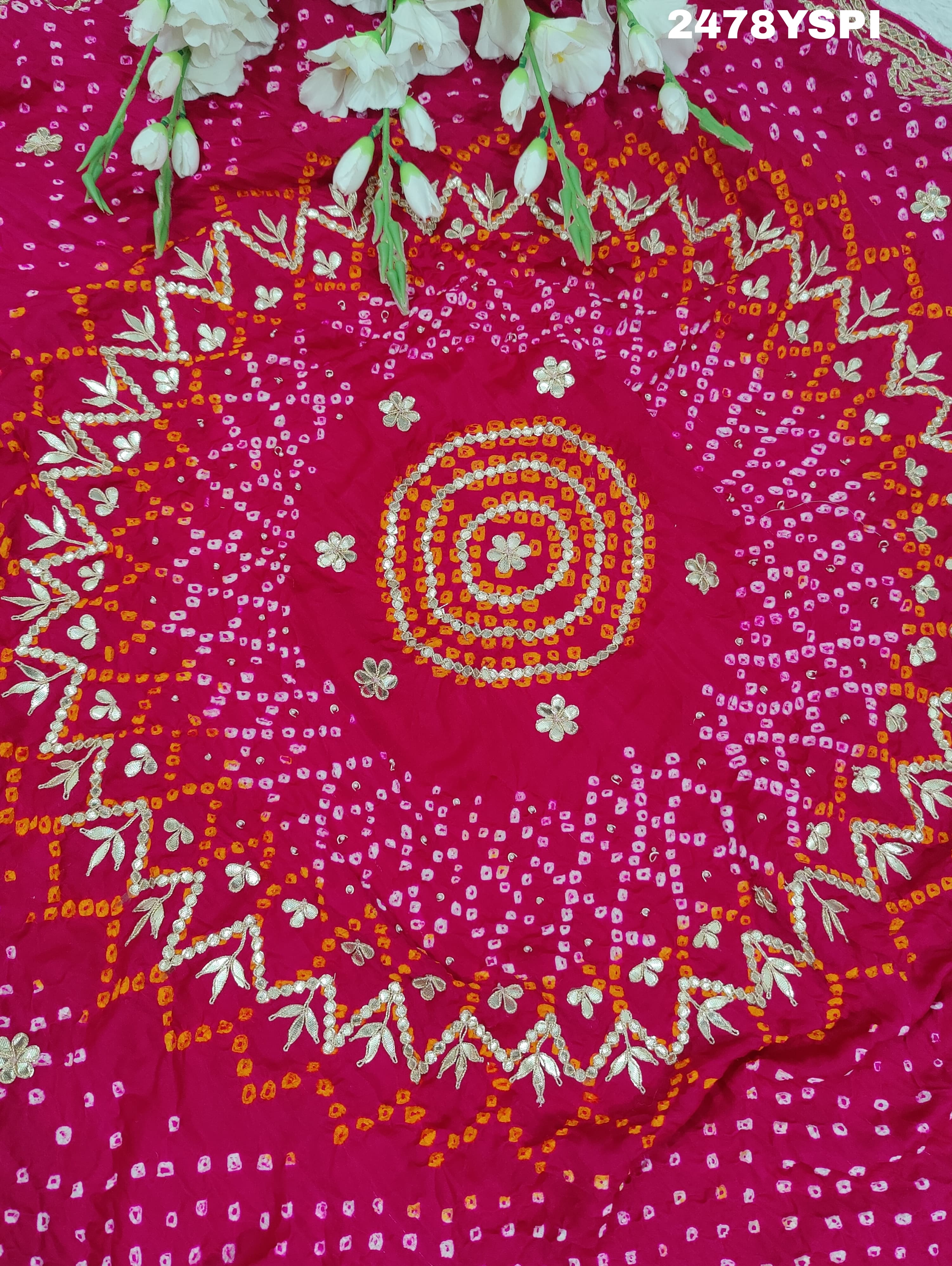 A pink Gaji silk saree with Bandhani style embellishments and Gotapatti work