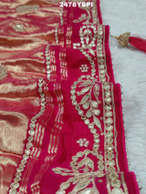 A pink Gaji silk saree with Bandhani style embellishments and Gotapatti work