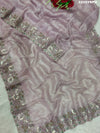 A purple tissue silk Bollywood style saree with sequence embroidery work